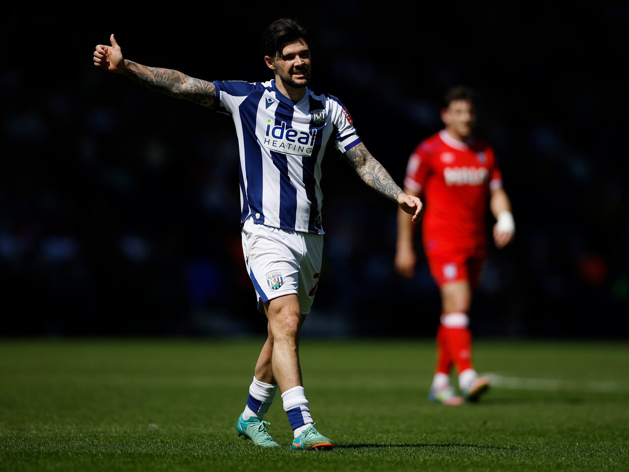 Alex Mowatt in action against Ipswich with his thumb up 