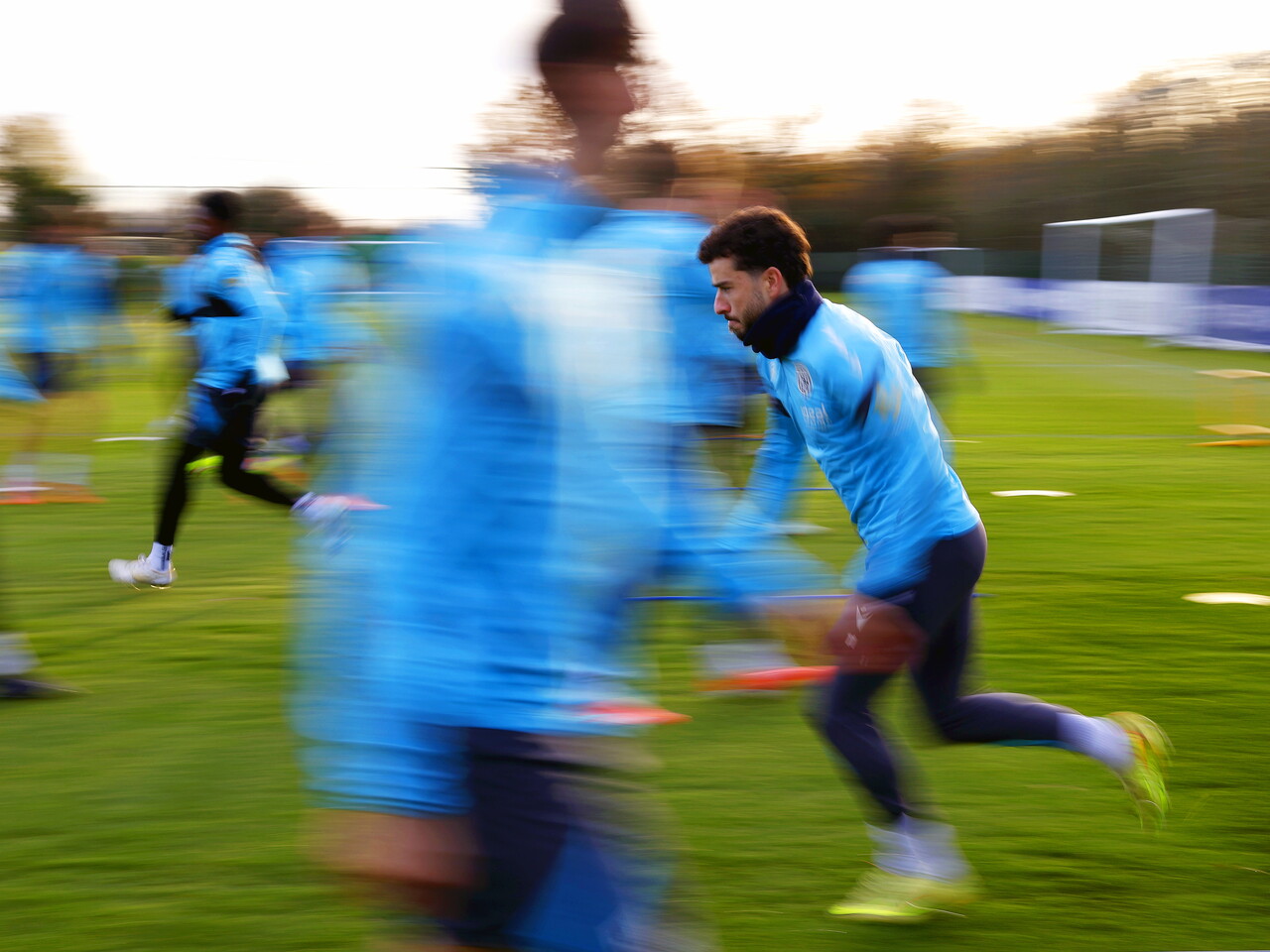 Mikey Johnston warming up before a training session