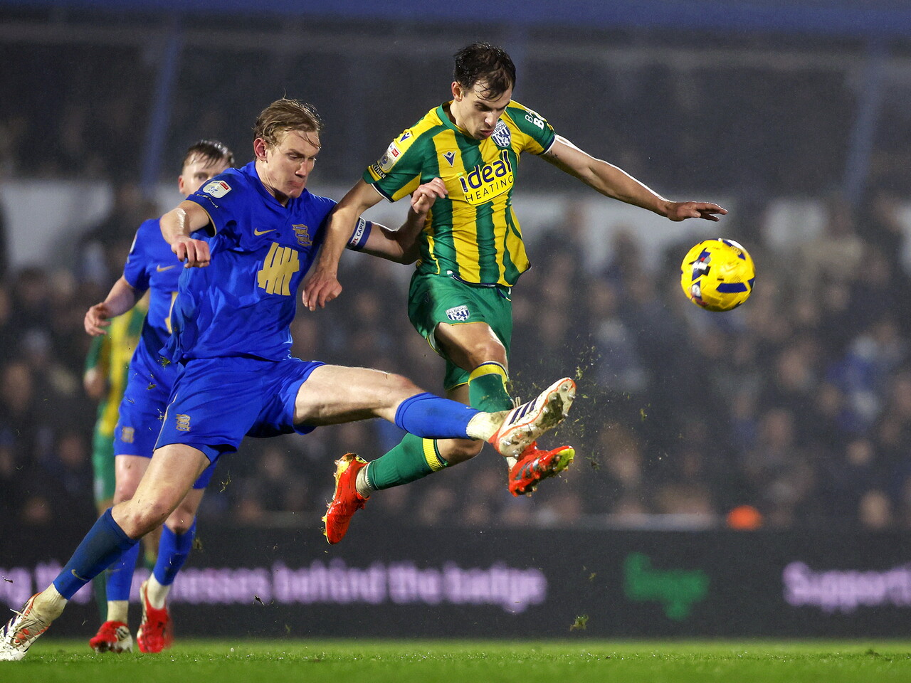 Jayson Molumby on the ball against Birmingham City in the green and yellow away kit 