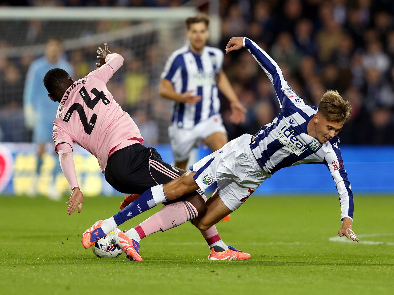 Isaac Price and a Leicester City player challenging for the ball at The Hawthorns