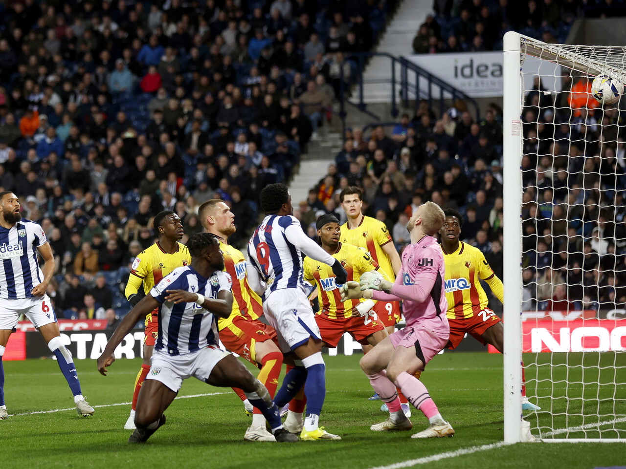 Daryl Dike scoring a header against Watford at The Hawthorns in the home kit