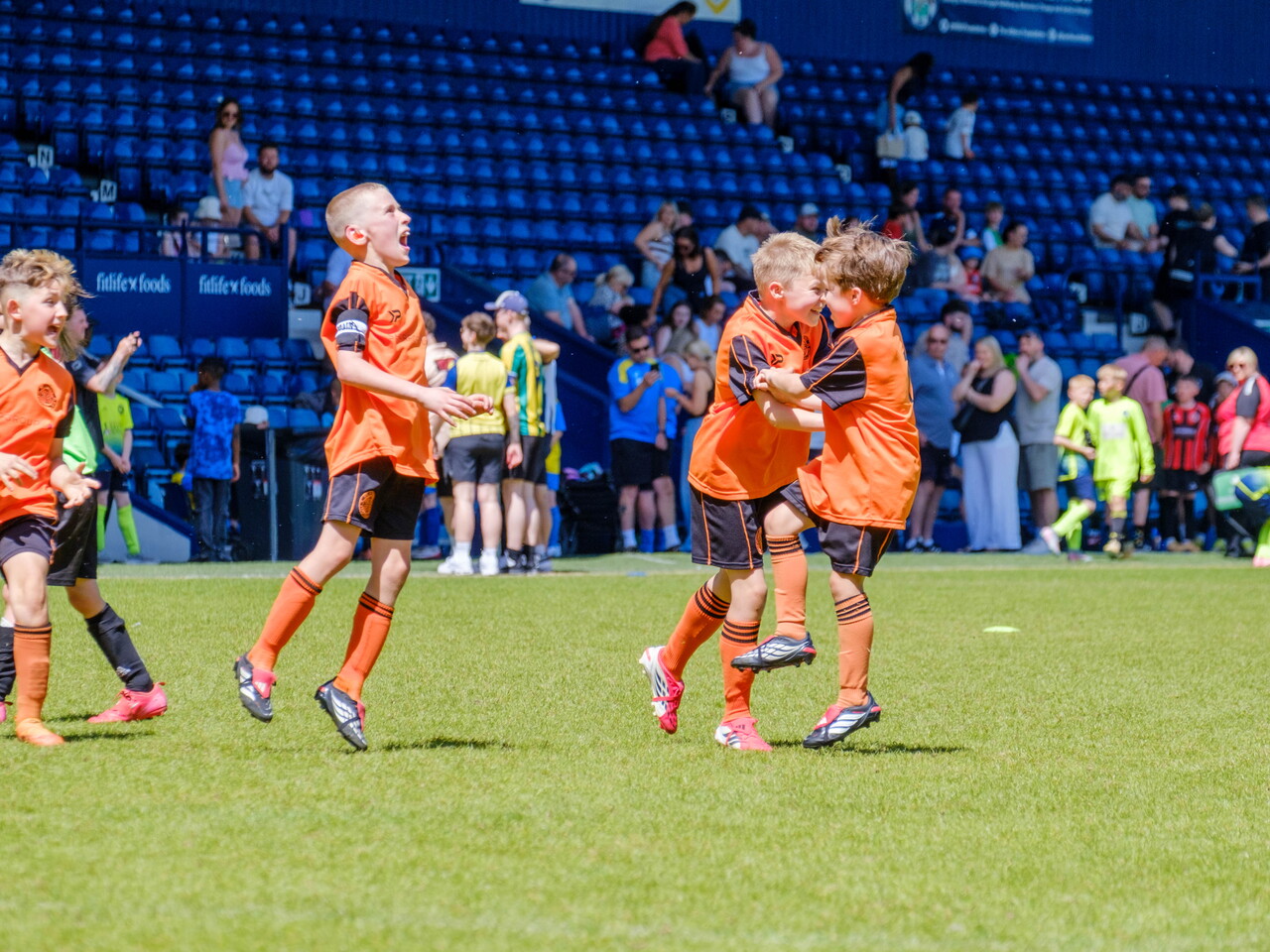 St Kevin's FC players celebrating a goal.