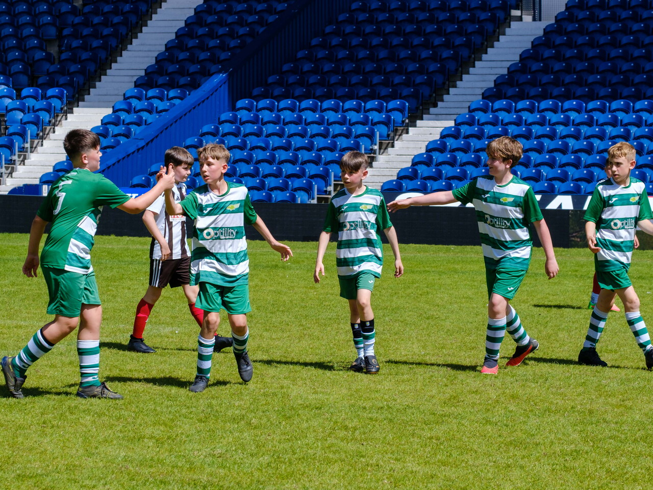 team shaking hands after a game.