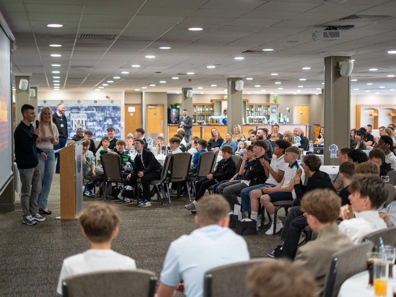 Wide shot of parents and players at MJPL Awards evening.