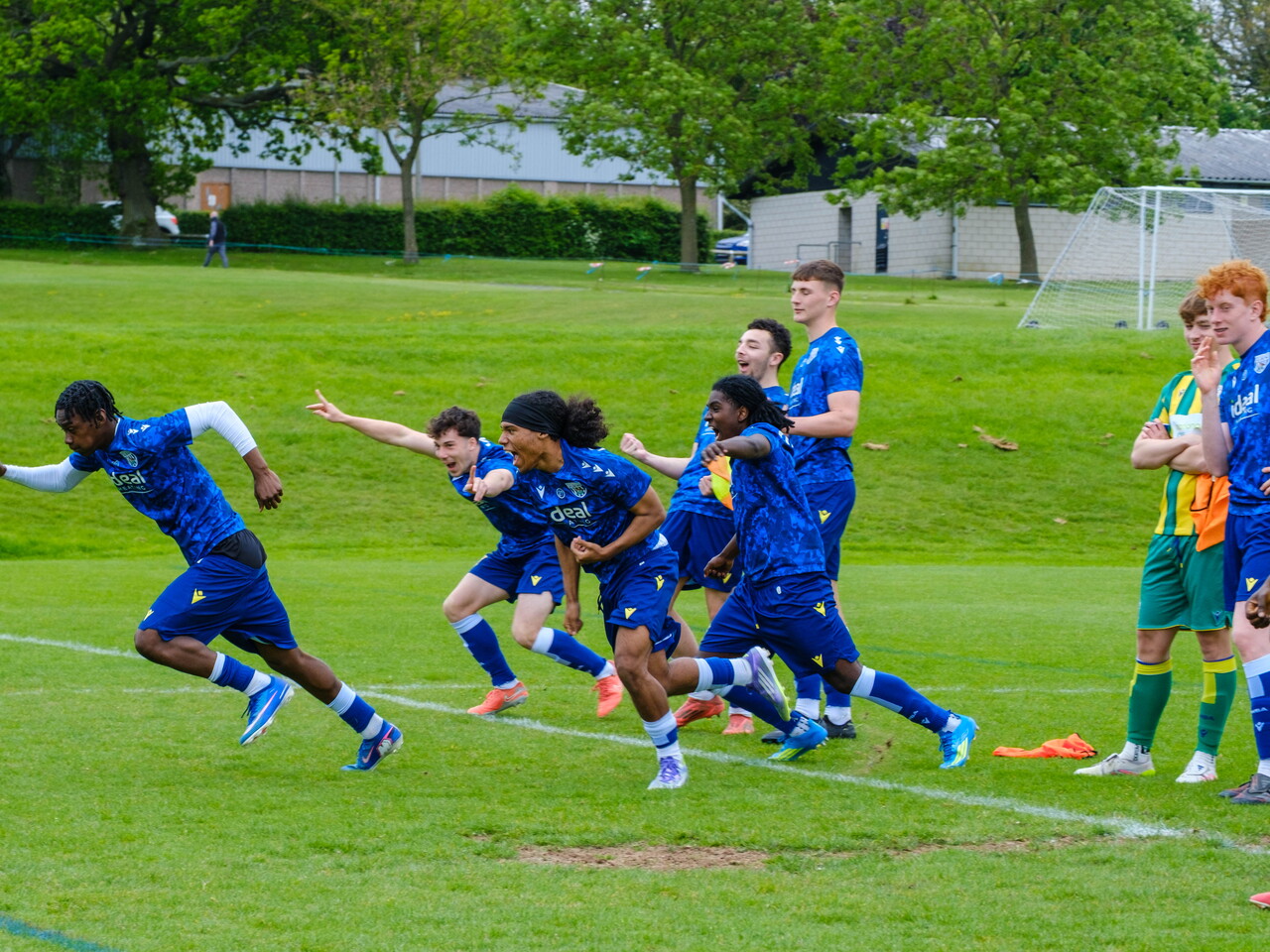 Players running in celebration after