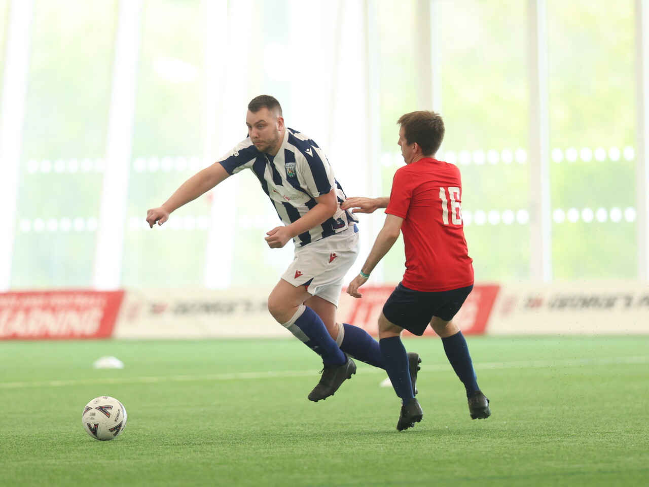 WBA Player battling for possession.