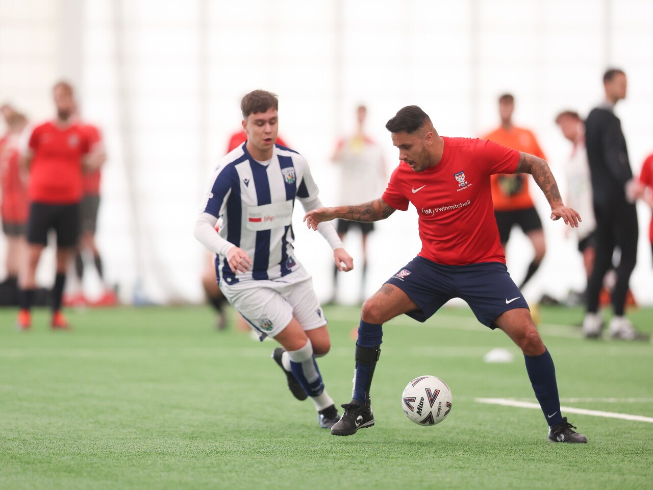 WBA Player challenging for the ball.