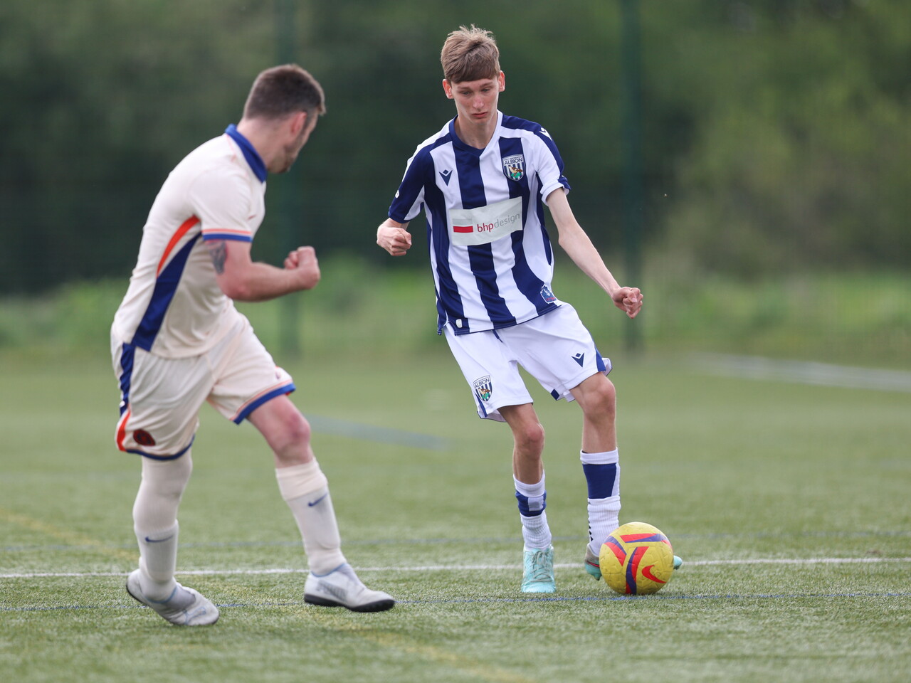 WBA Player driving with the ball