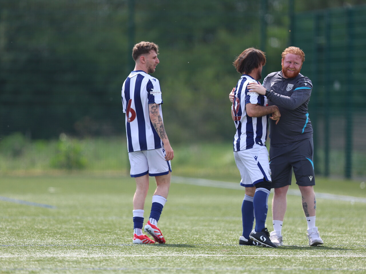 WBA coach giving a player a high-five.
