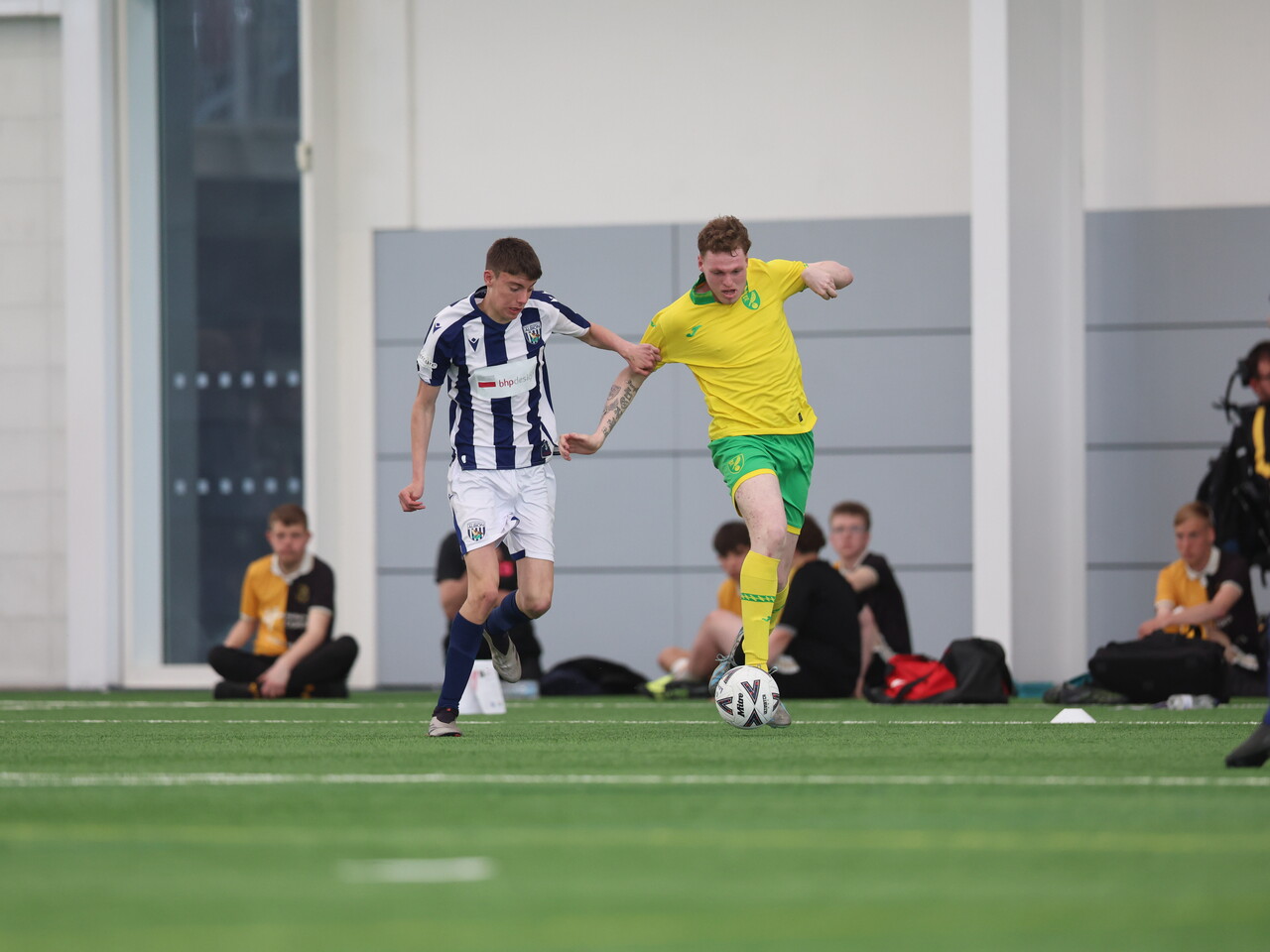 WBA Player battling for possession.