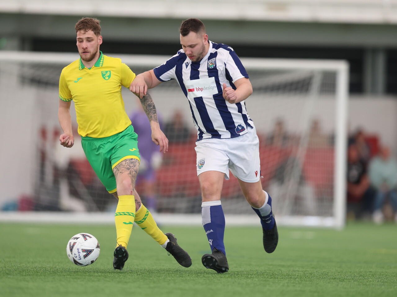 WBA Player battling for possession.