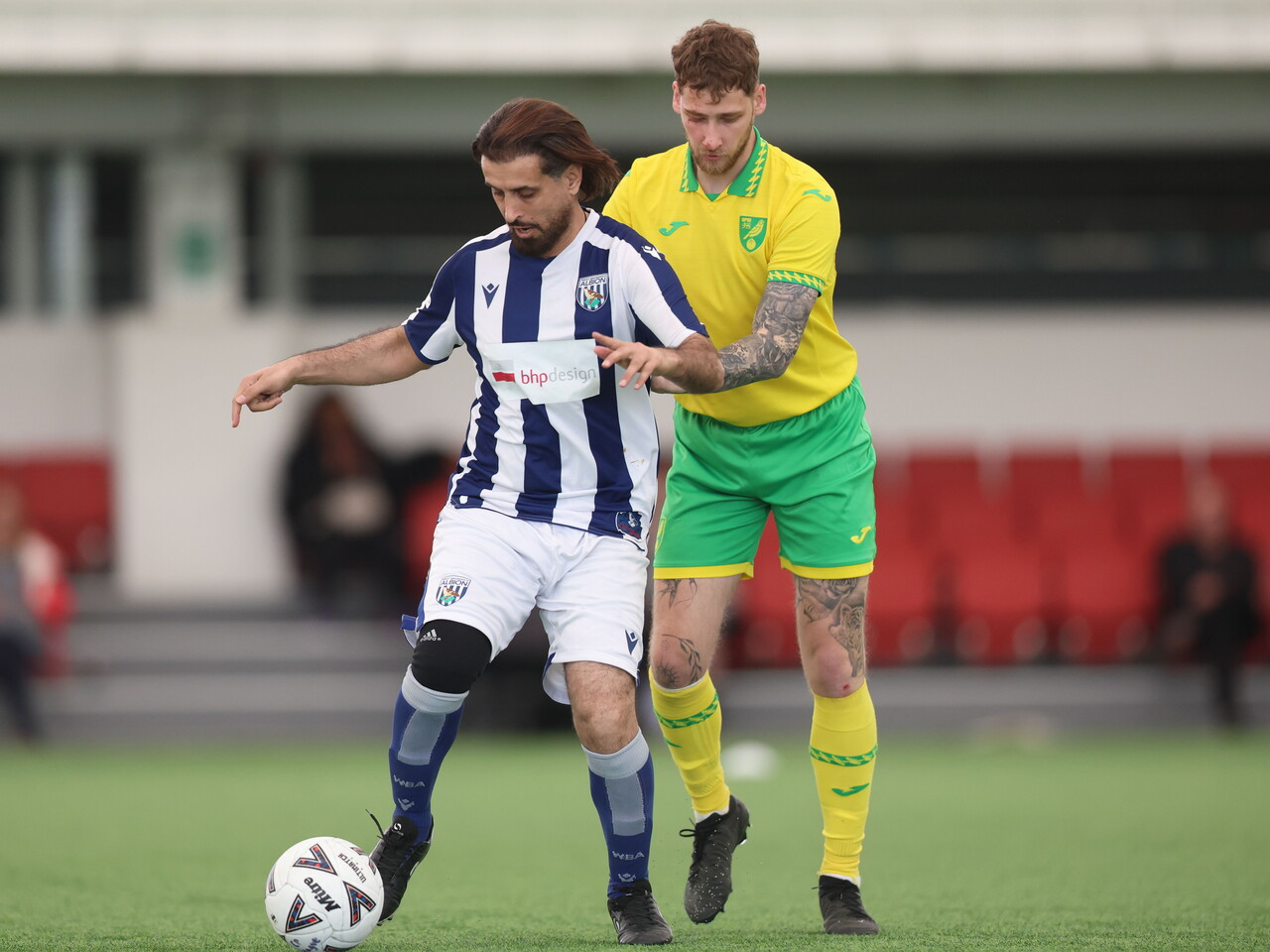 WBA Player battling for possession.