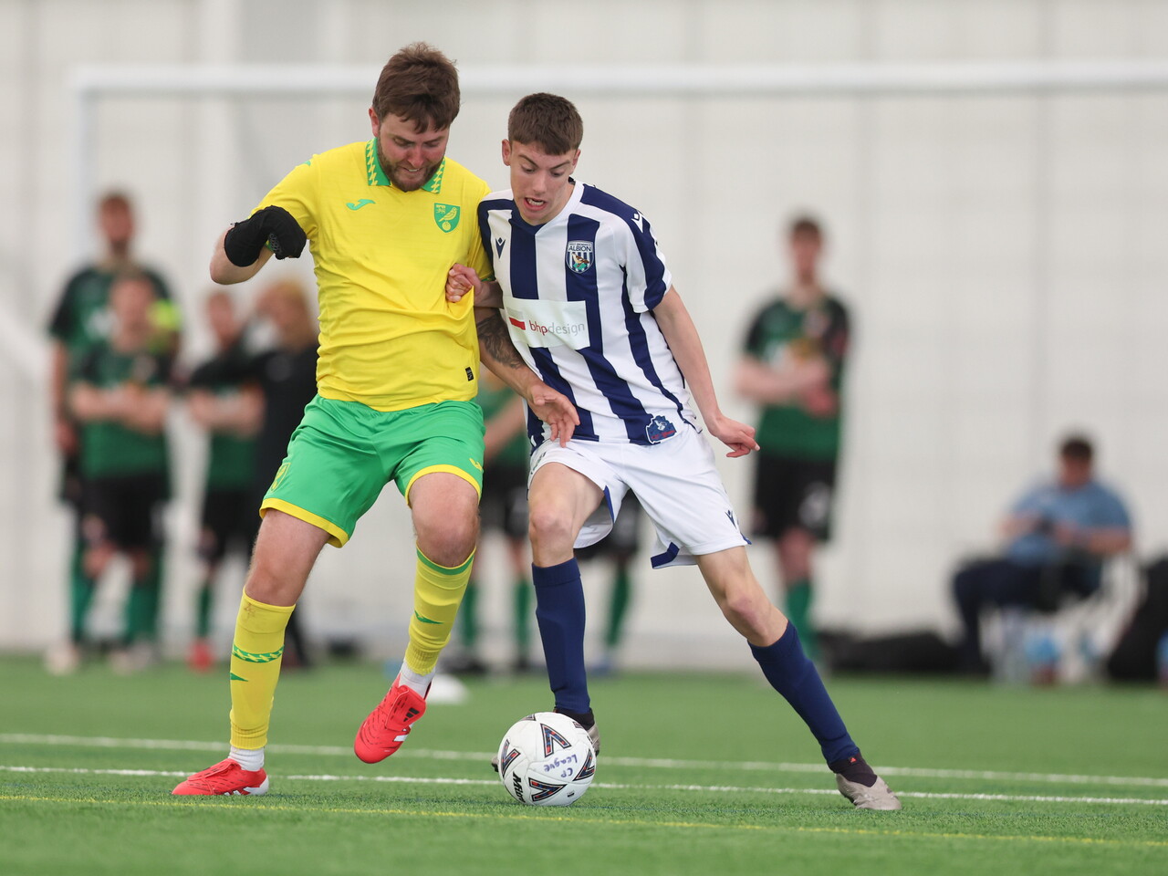 WBA Player battling for possession.