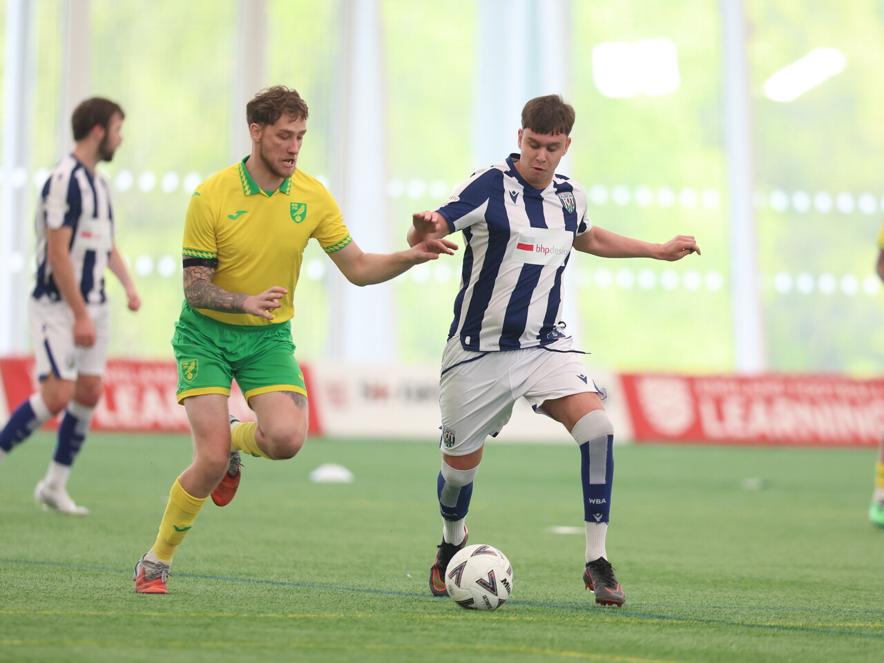 WBA Player on the ball.