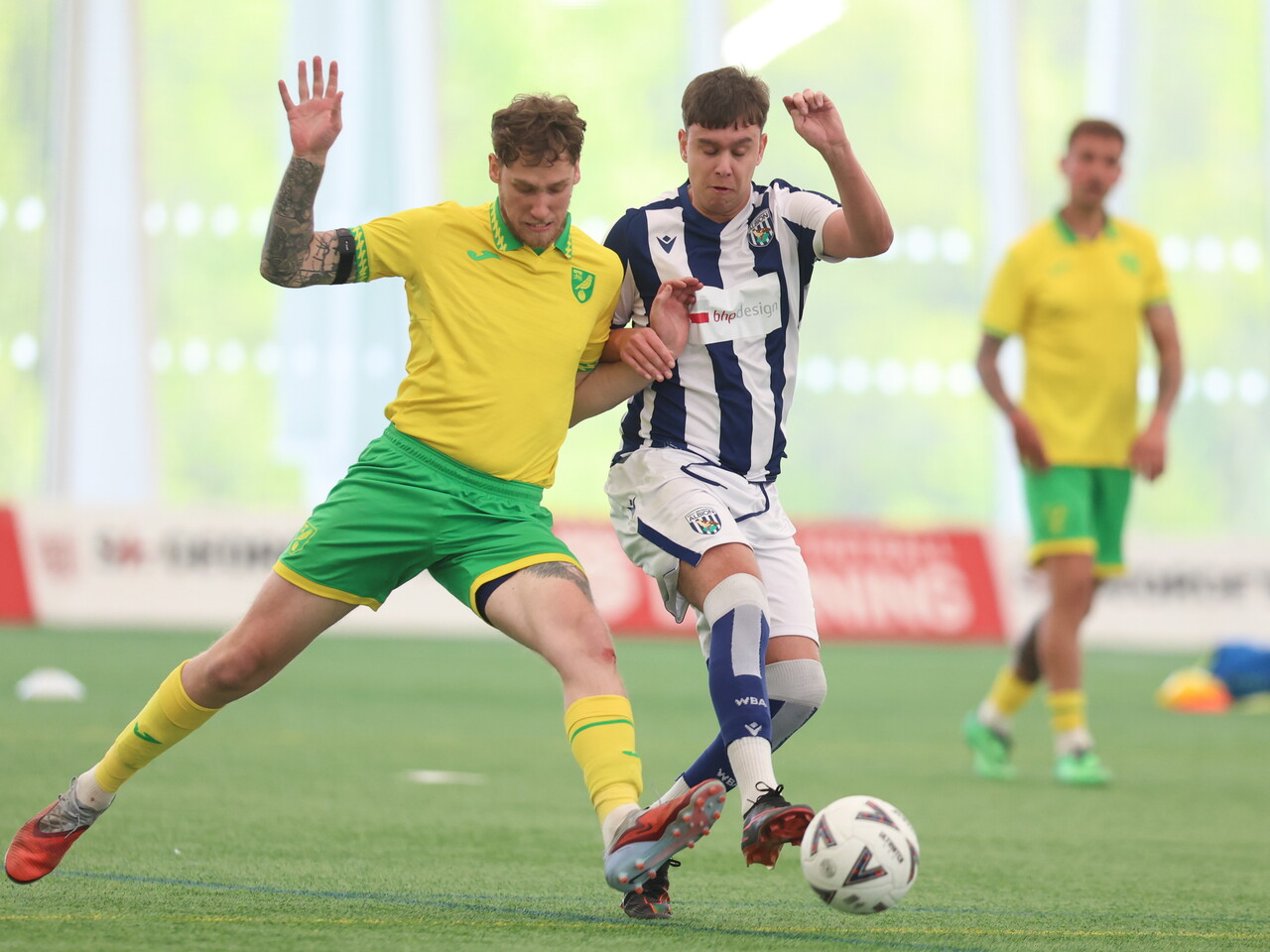 WBA player holding off the opposition.