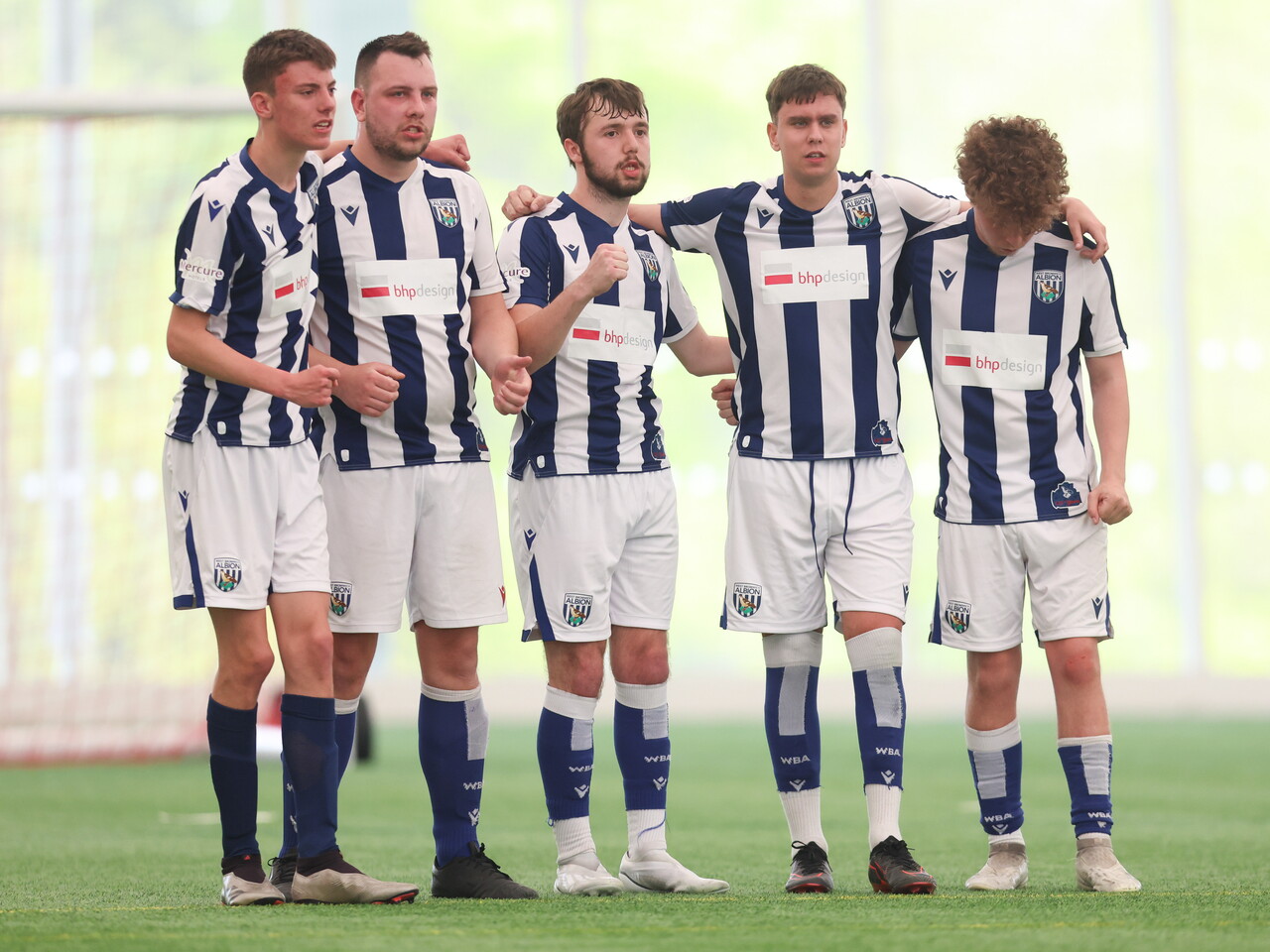 WBA Players in discussion on the pitch.