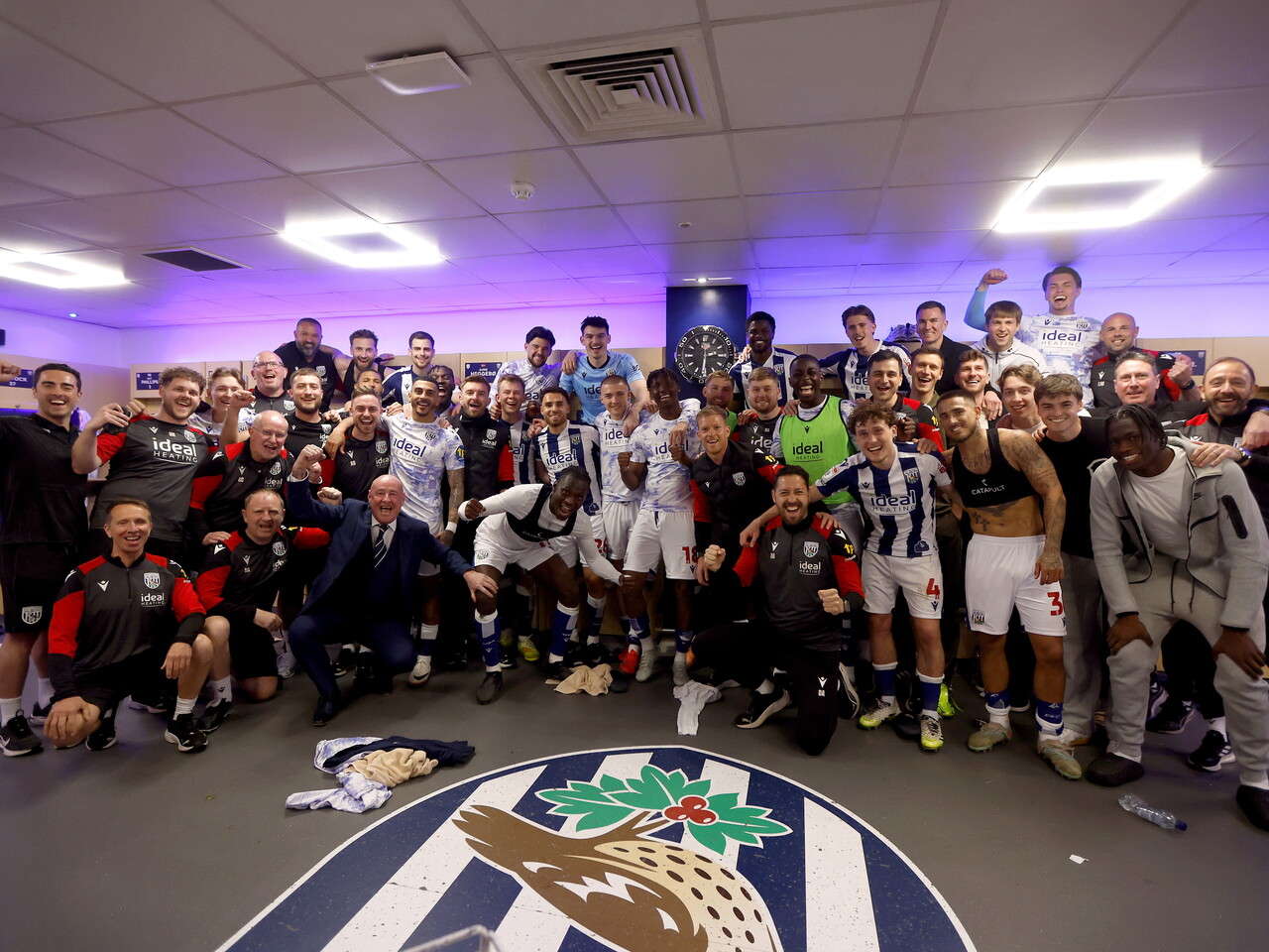 WBA players and staff pose for a team photo in the dressing room at The Hawthorns