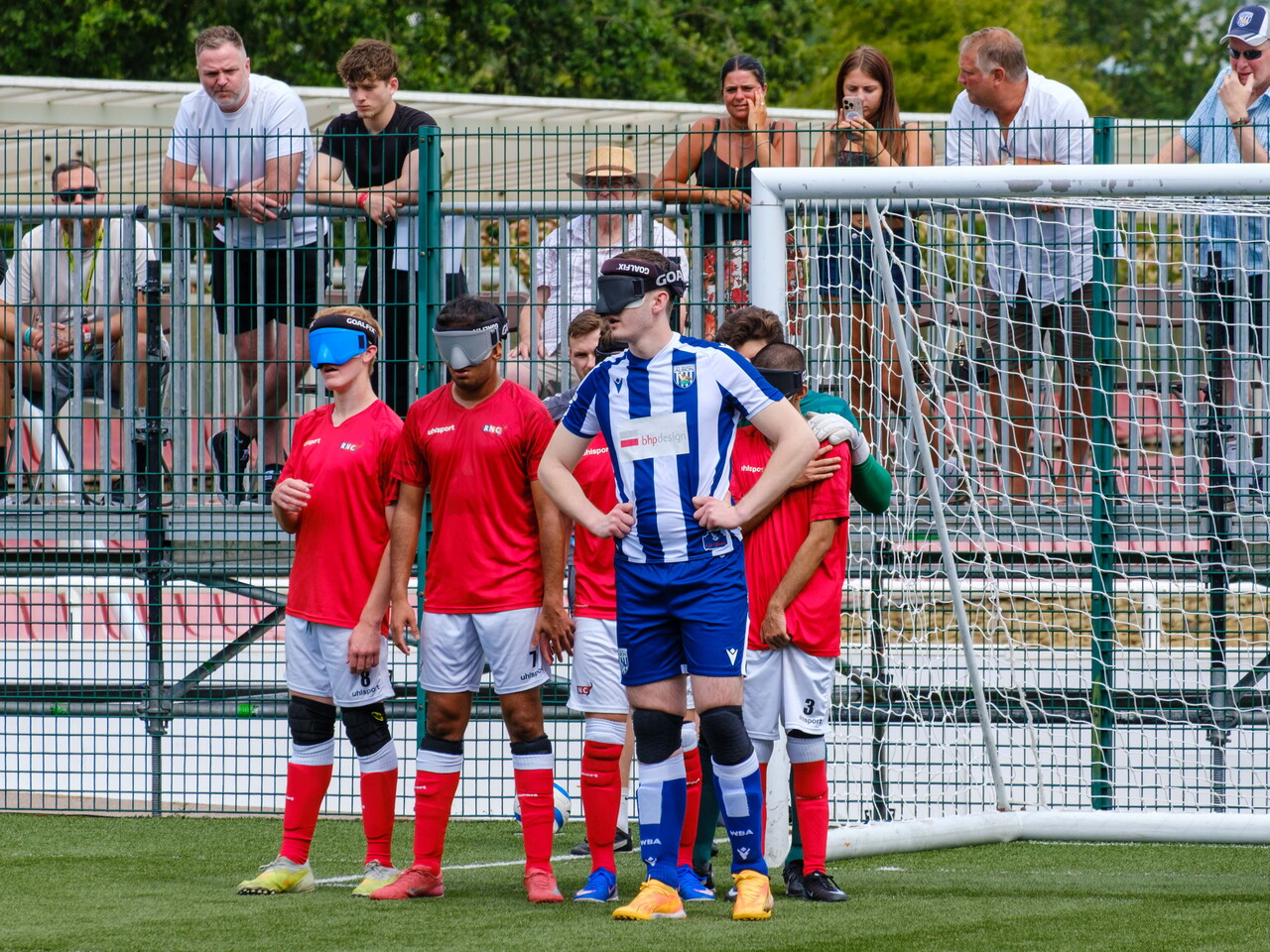 Efe Shimwell standing in front of the RNC wall as WBA Blind prepare for a free kick.