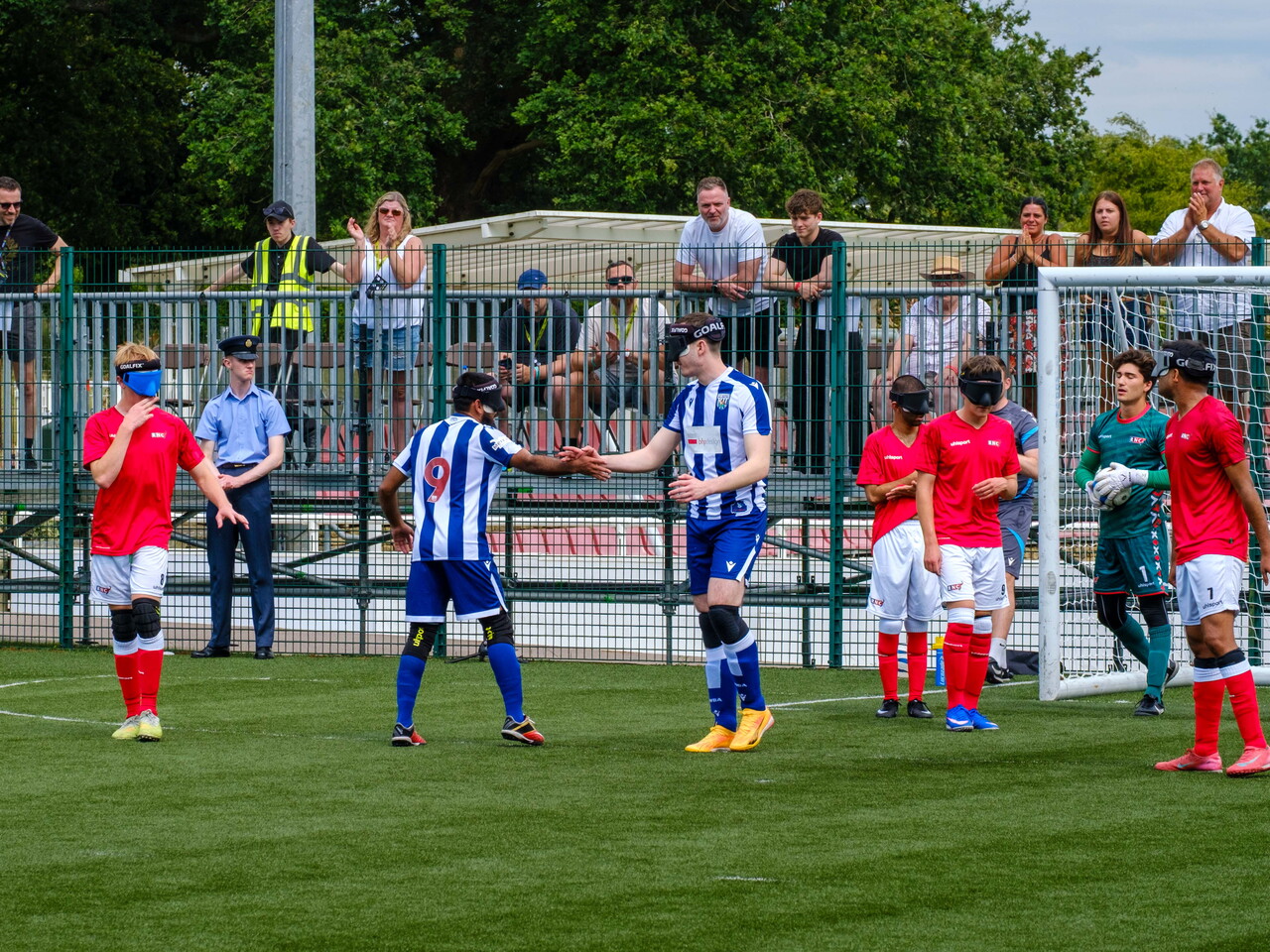 Eesa and Efe shaking hands in celebration, after scoring the second goal.
