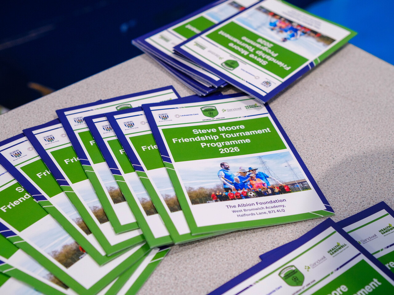 Event programmes on a desk.