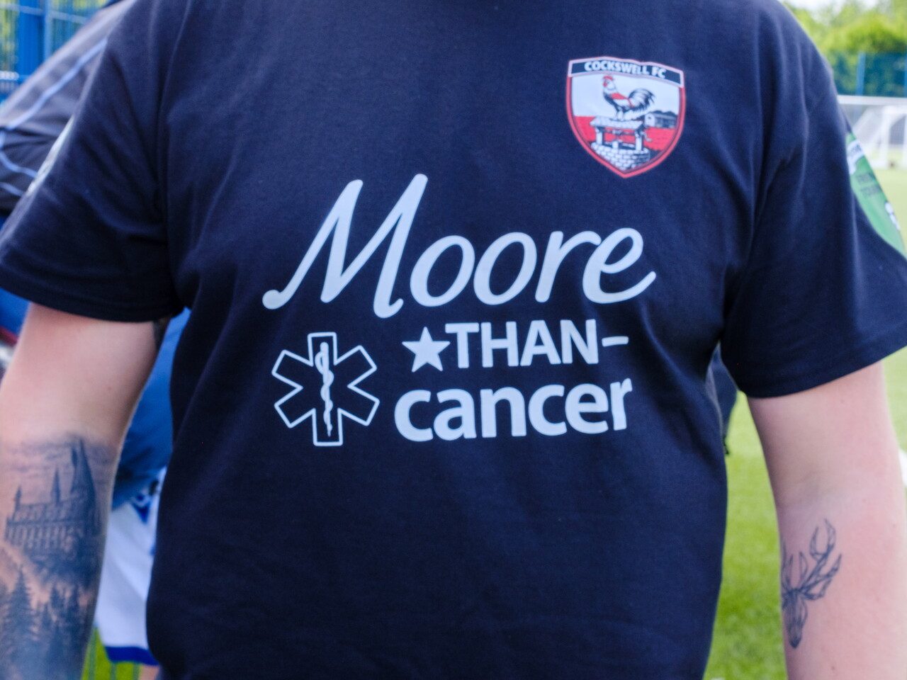 Close-up of the front of Moore Than Cancer team t-shirt