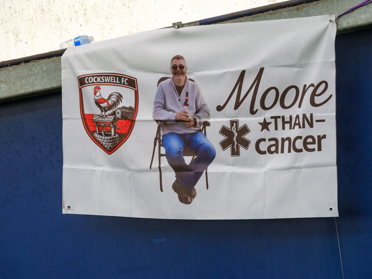 Close-up of Moore than Cancer tribute banner.