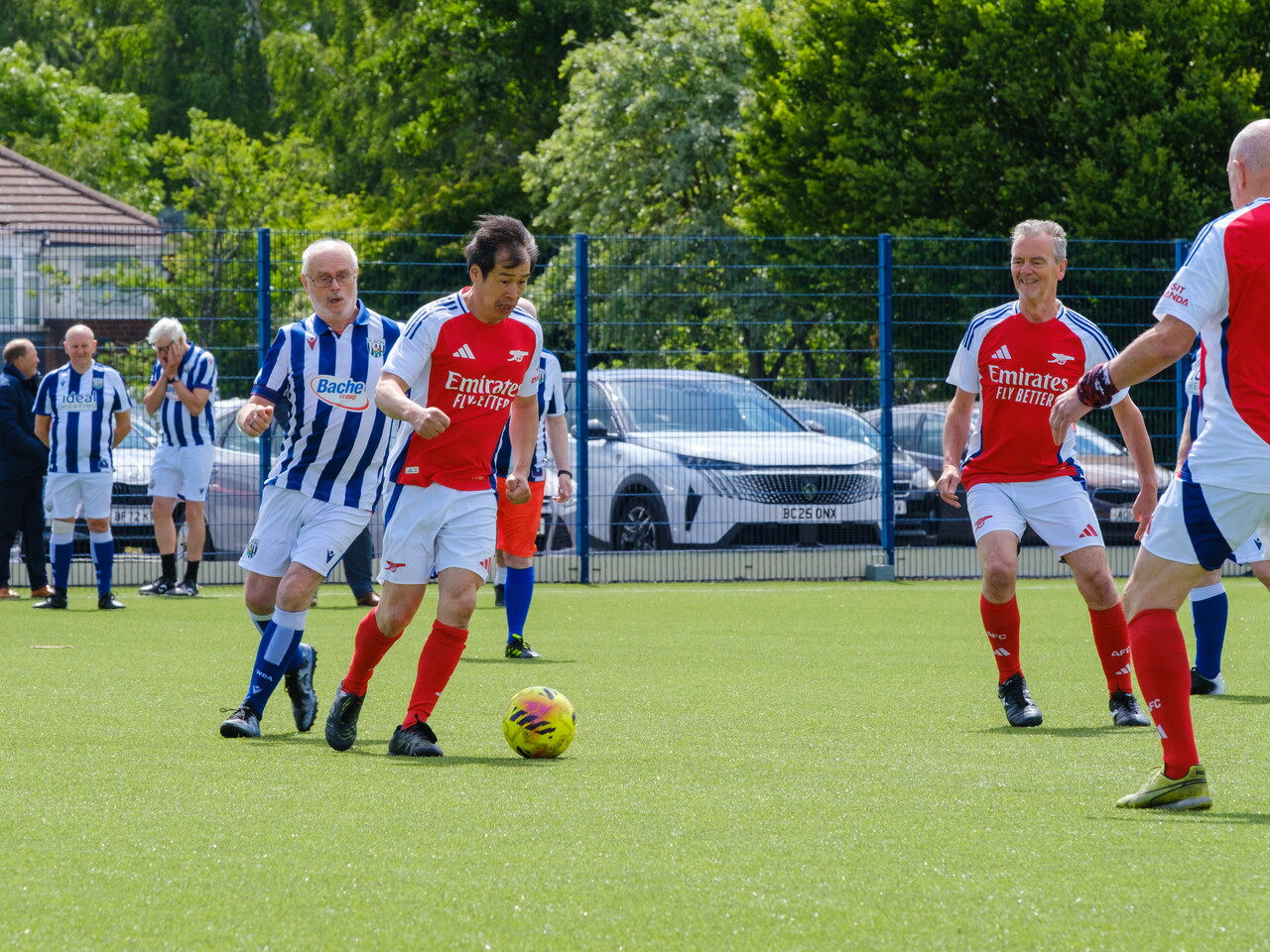 Arsenal player on the ball, looking to make a pass.