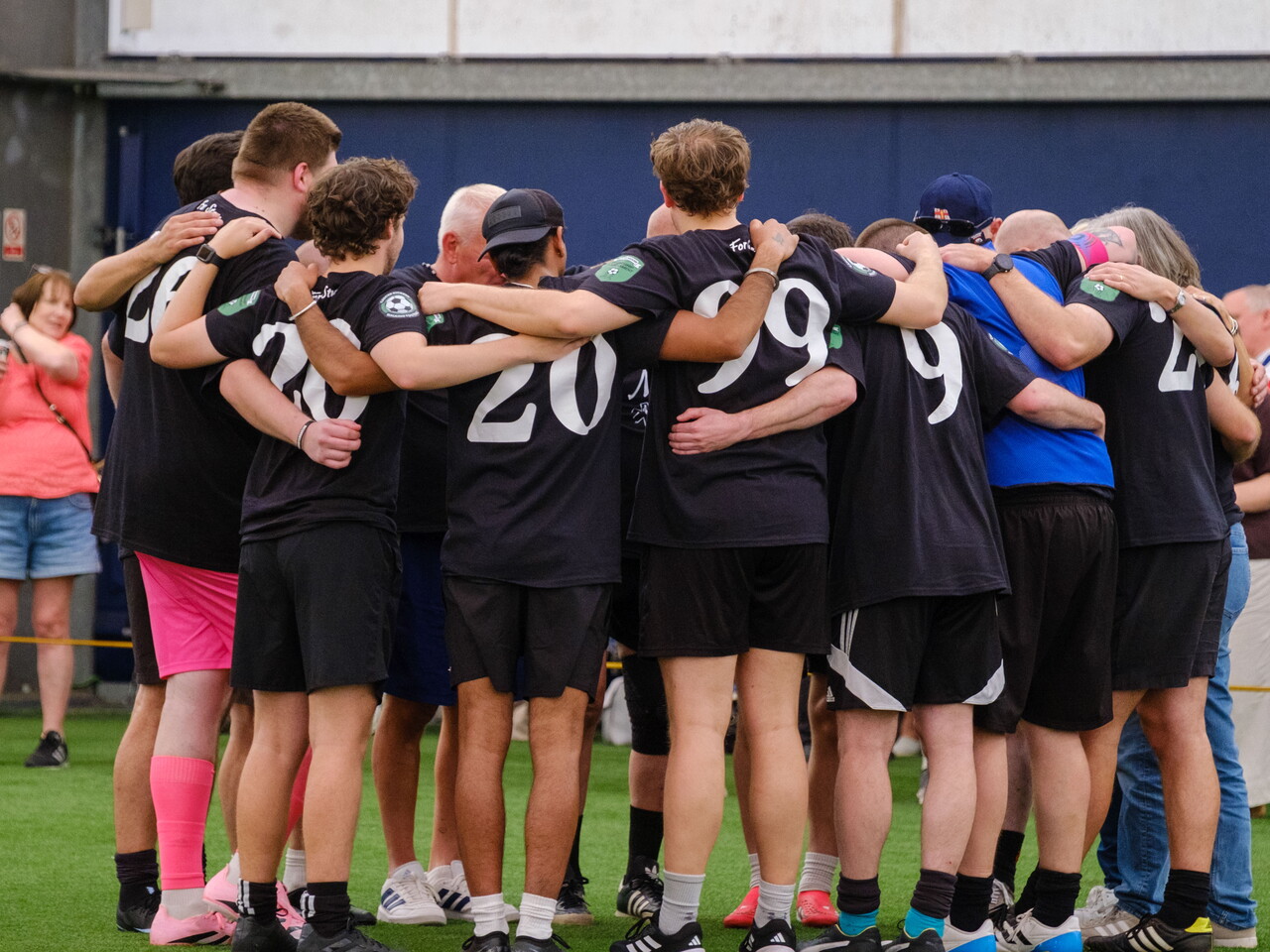 Moore than Cancer team huddle before the final.