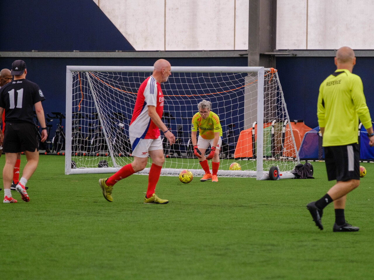 Arsenal goalkeeper rolling the ball out to teammate.