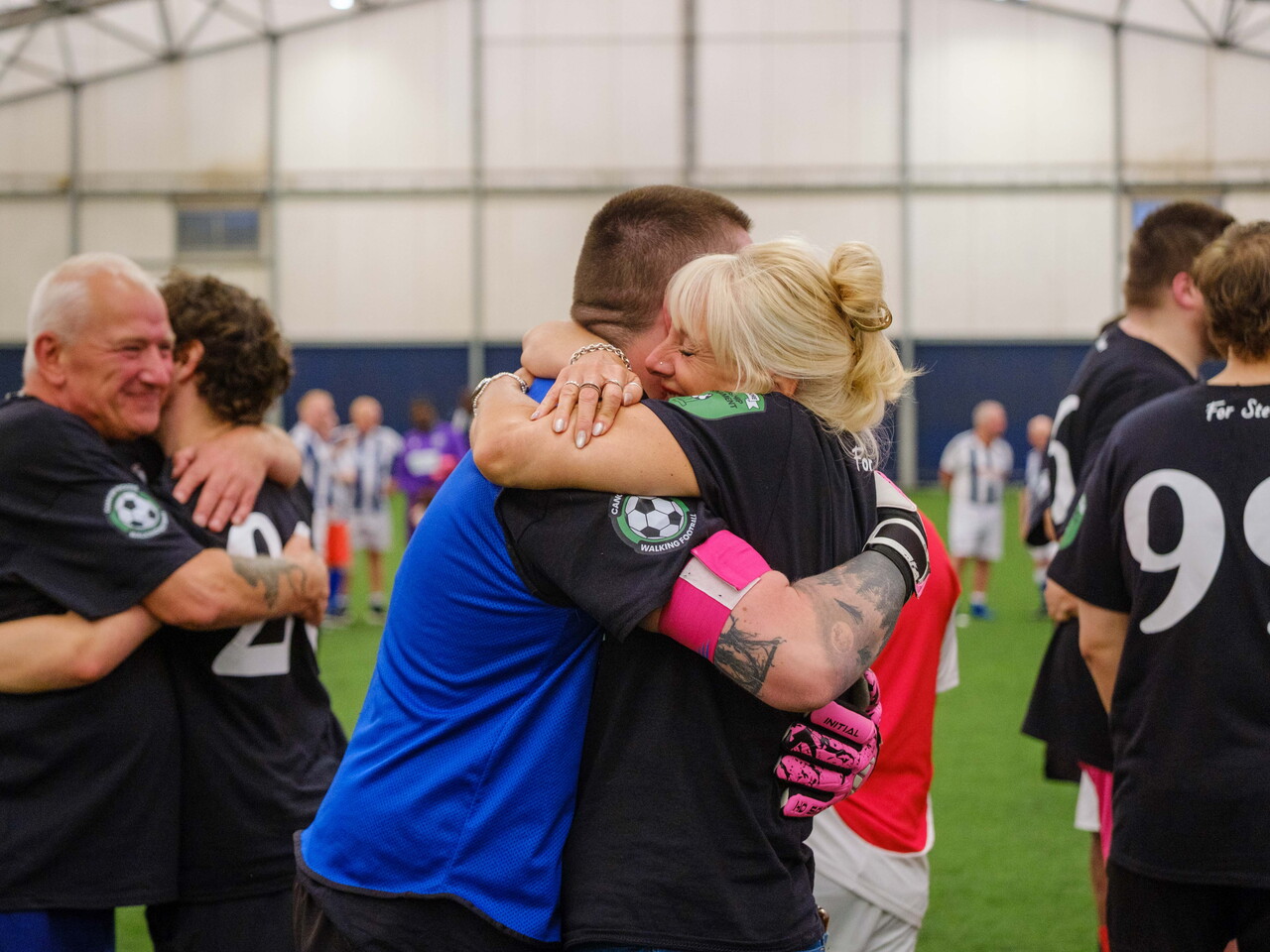 Ruth Moore hugging Moore than Cancer goalkeeper after the match.