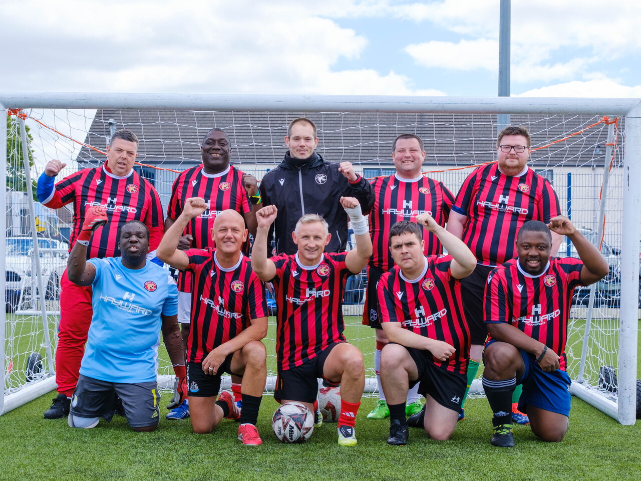Beat the Block (Walsall FC Foundation) team photo in front of the goal.