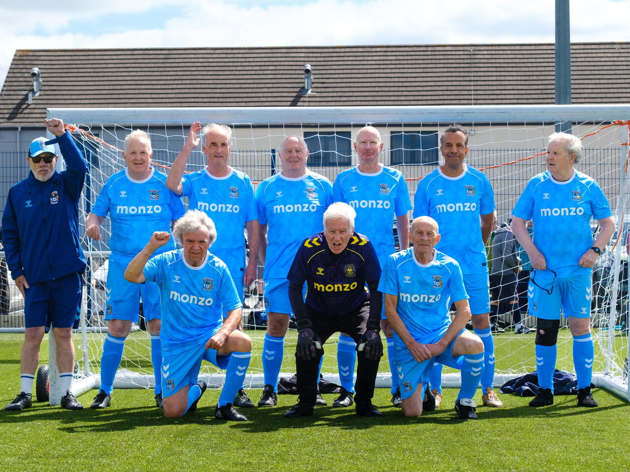 Sky Blues in the Community (Coventry City) team photo in front of the goal.