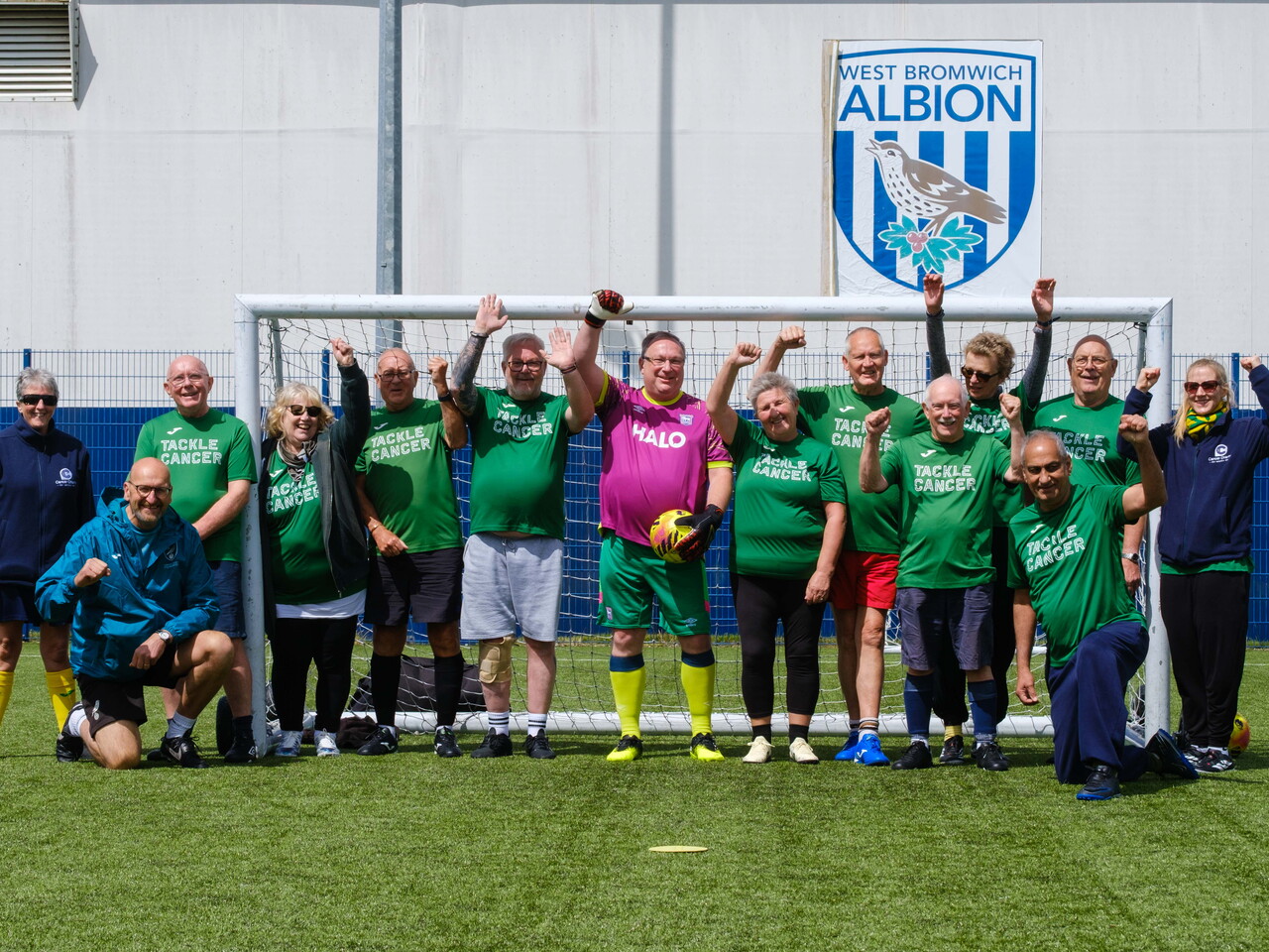 Big C Tackling Cancer (Norwich City Community Sports Foundation) team photo in front of the goal.