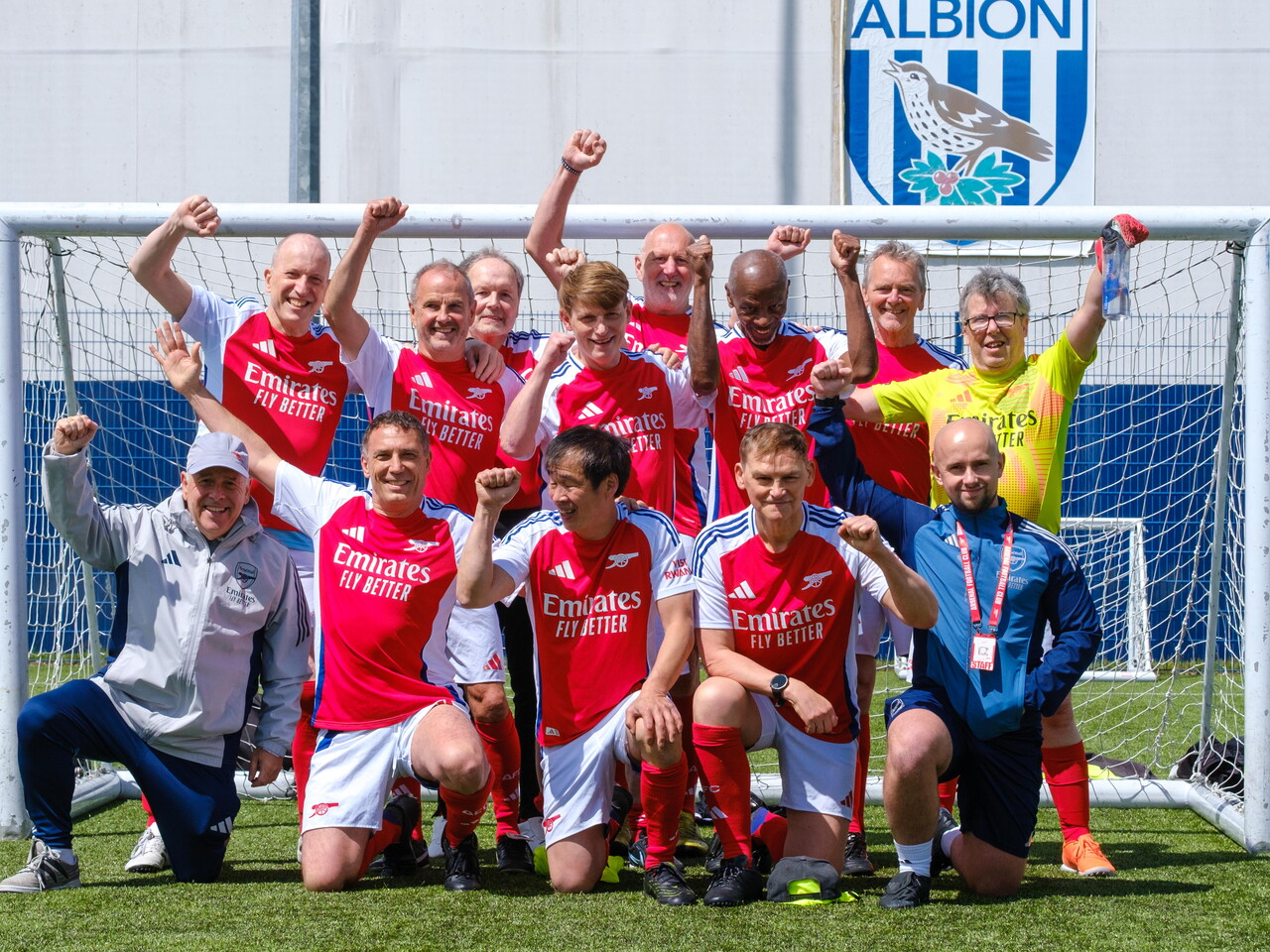 Arsenal in the Community team photo in front of the goal.