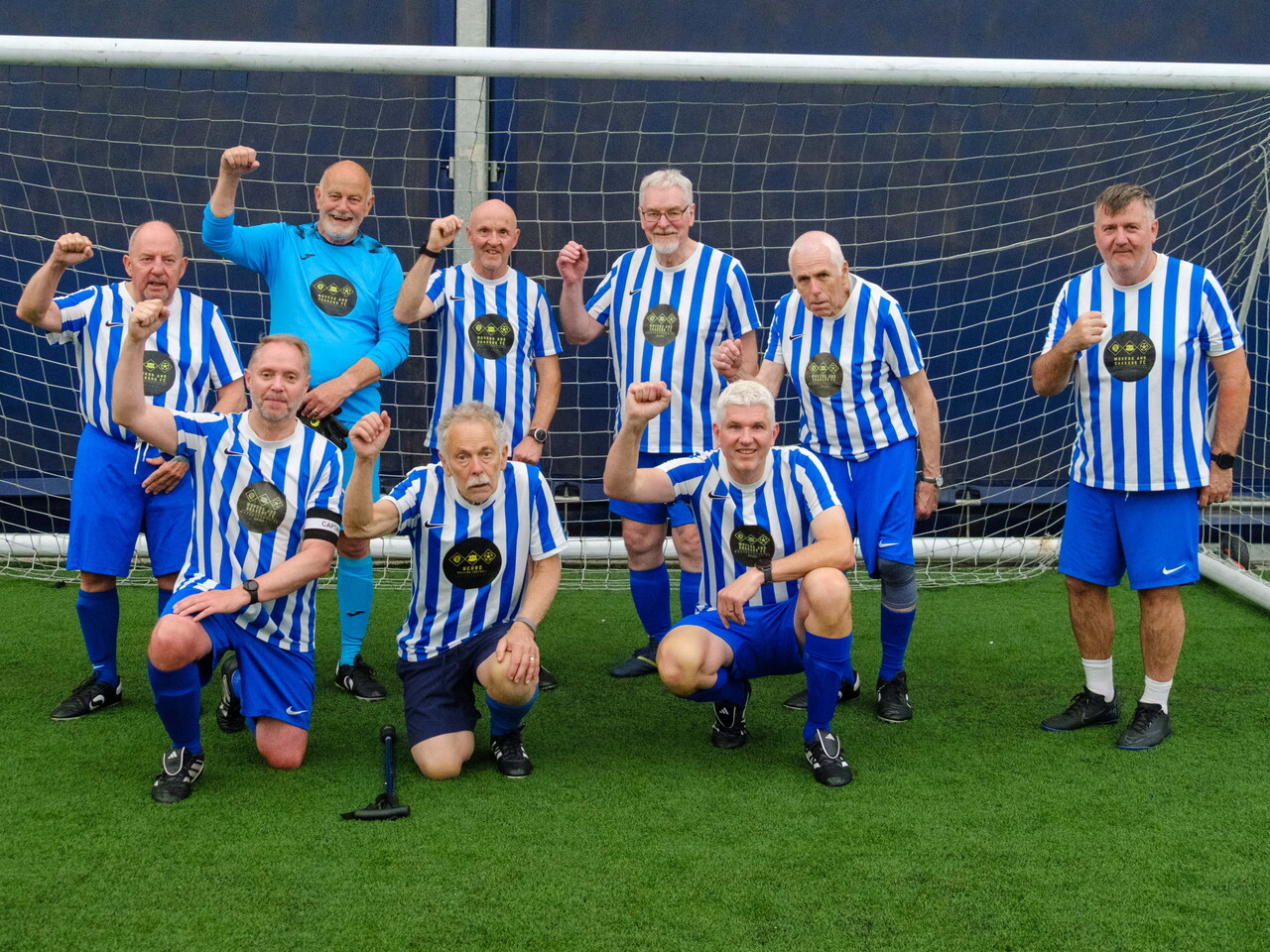 Neuro Walking Football Worcestershire (Movers and Shakers FC) team photo in front of the goal.