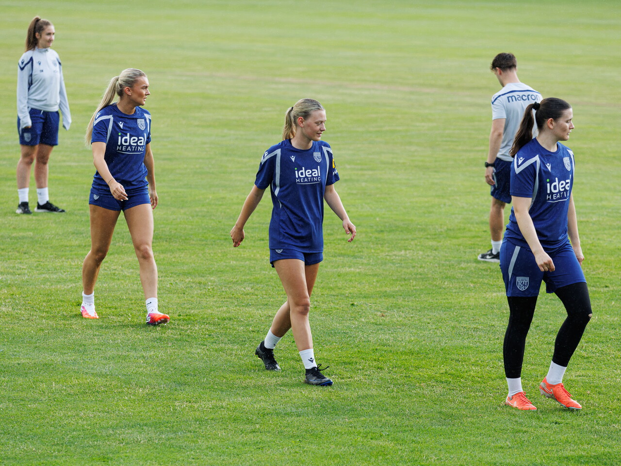 Taylor Reynolds, Naomi Sharp and Charlotte Clarke in a line during a training session