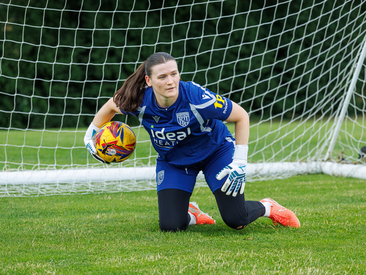 Charlotte Clarke rolling the ball out during a training session