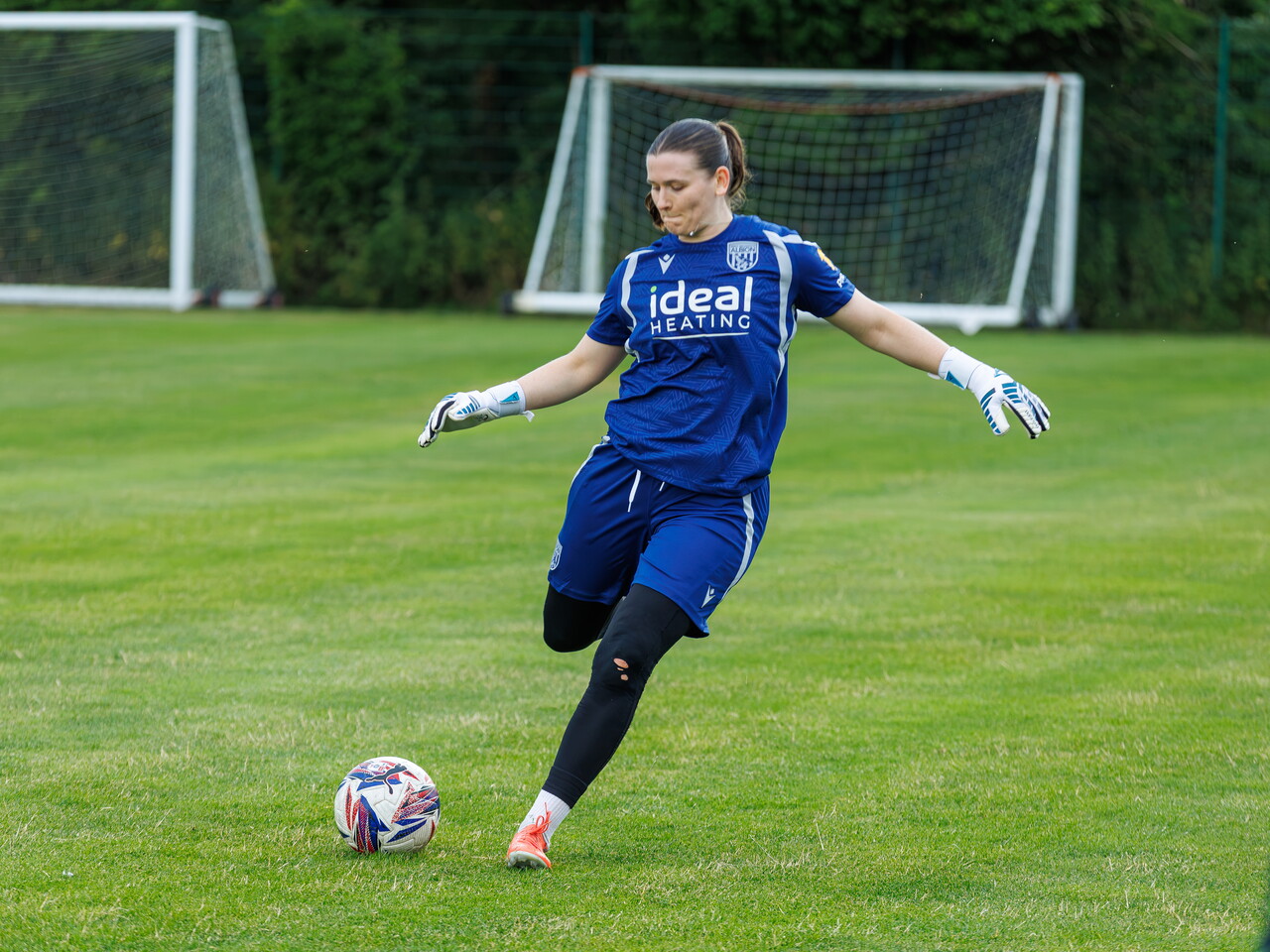 Charlotte Clarke kicking the ball during a training session