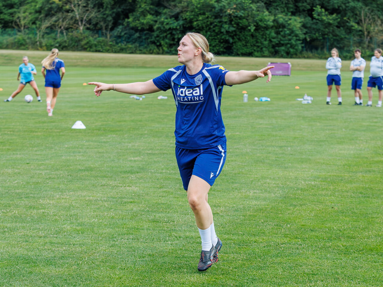Hannah George with her arms spread out during a training session