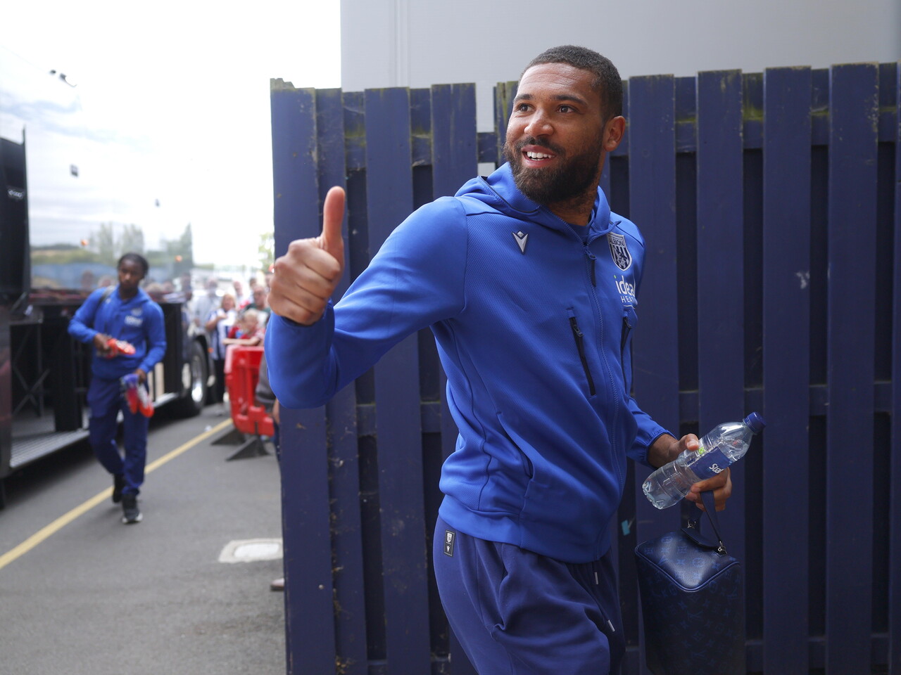 George Campbell waves at the fans before the game
