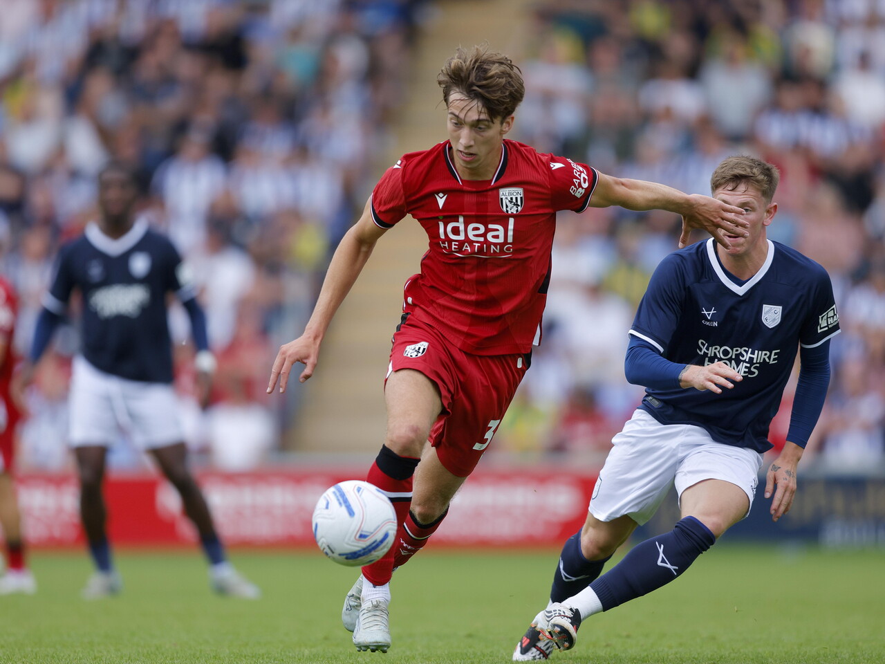 Harry Whitwell plays against Shrewsbury.