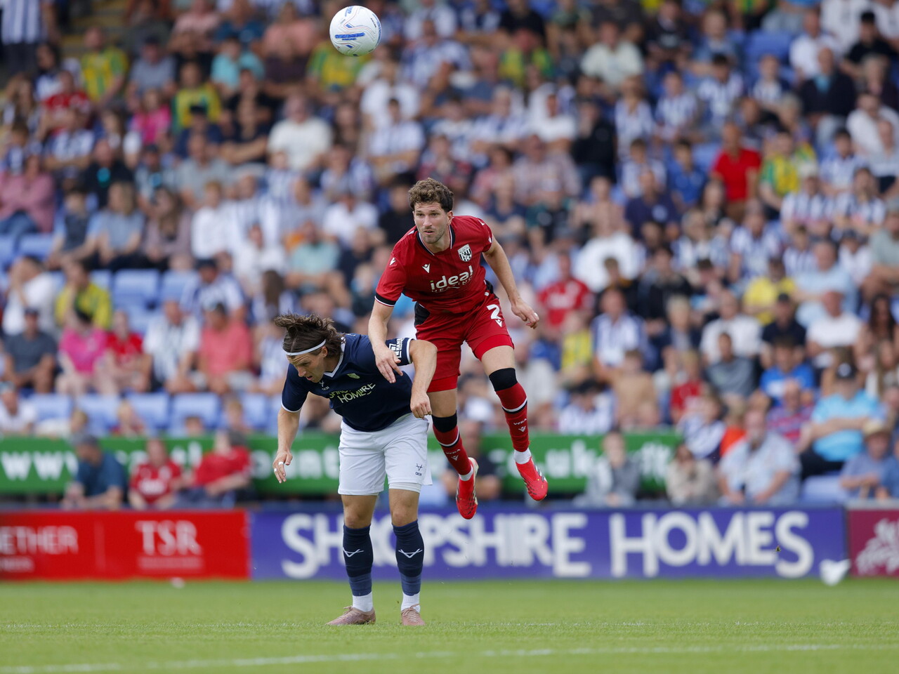 Chris Mepham wins a header against Shrewsbury