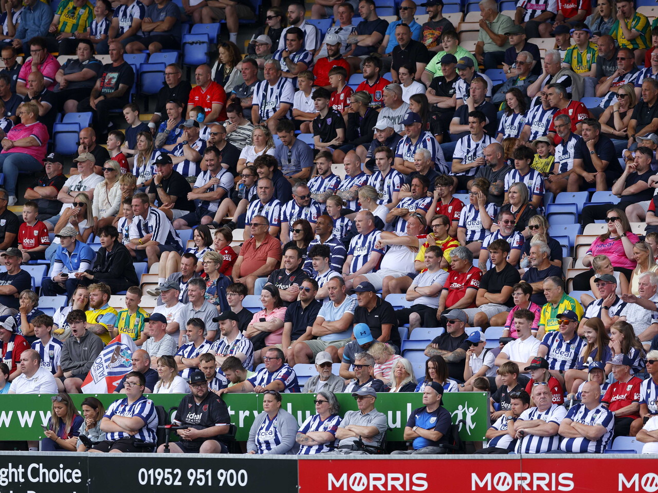 Albion fans celebrate the fourth goal