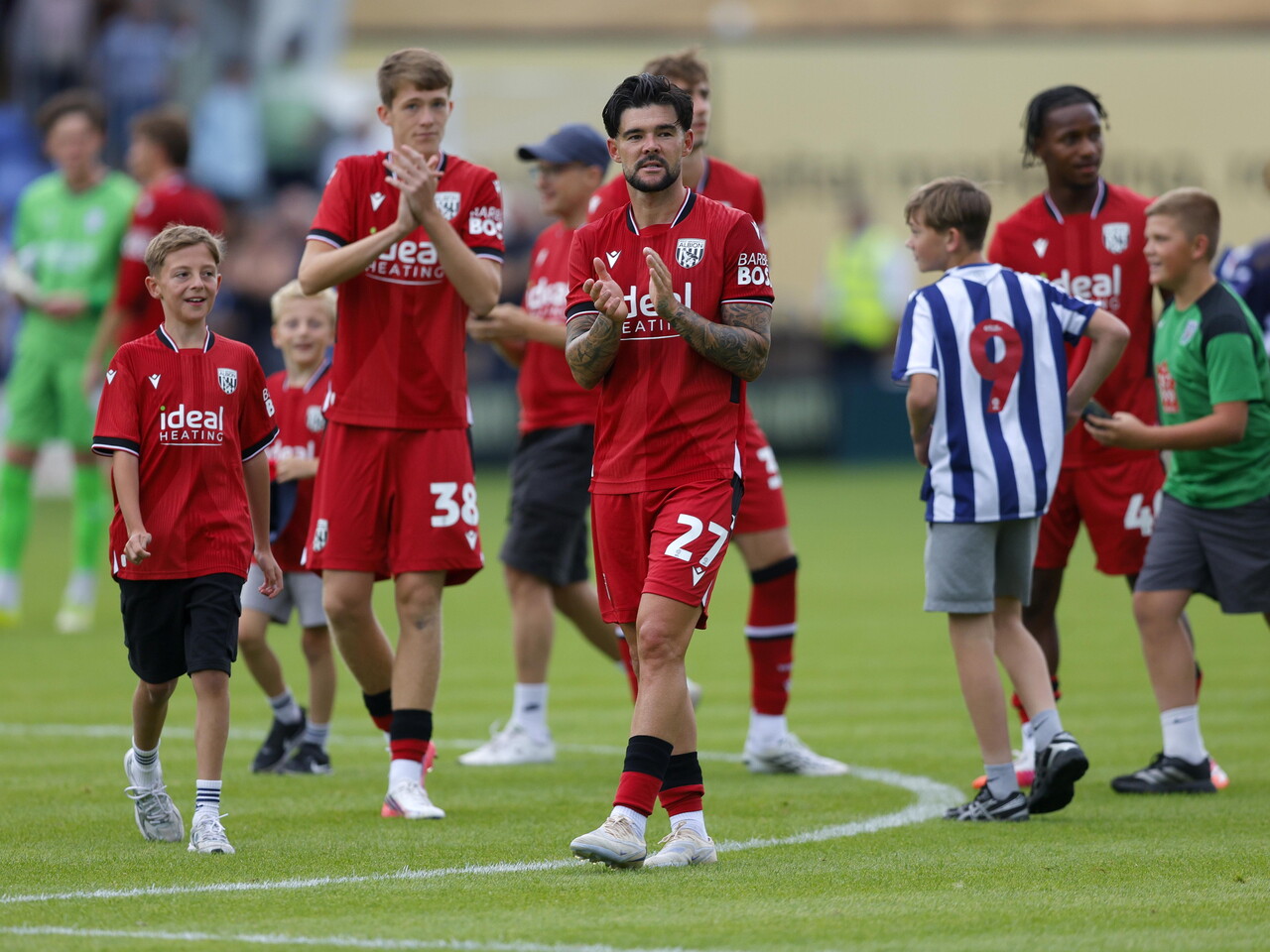 Alex Mowatt applauds the fans after the game