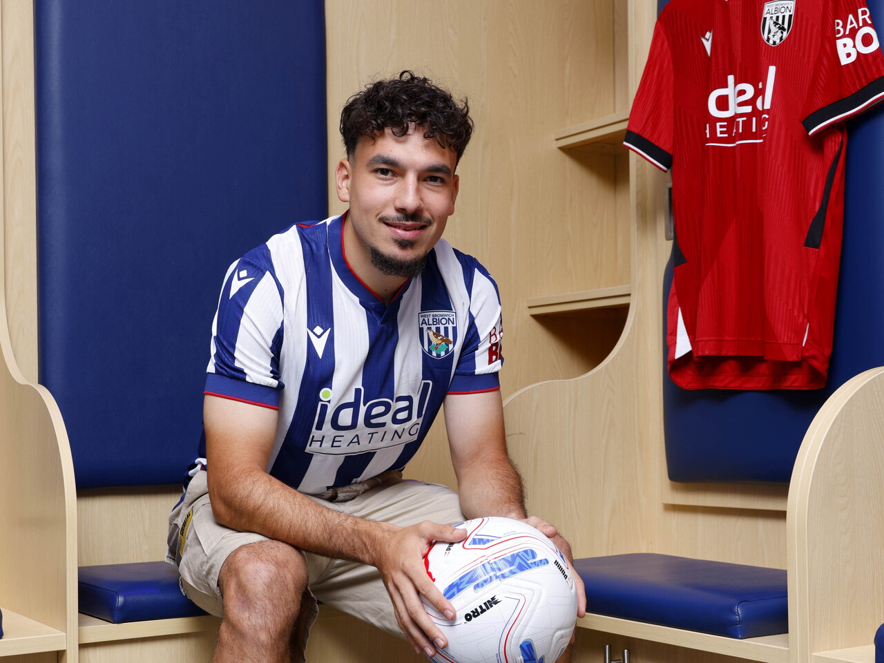 Nolan Galves sat in the home dressing room in a home shirt holding a ball