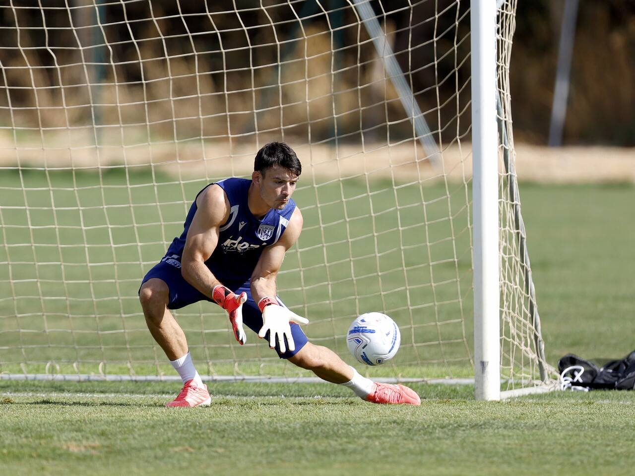 Max O'Leary making a save during a training session
