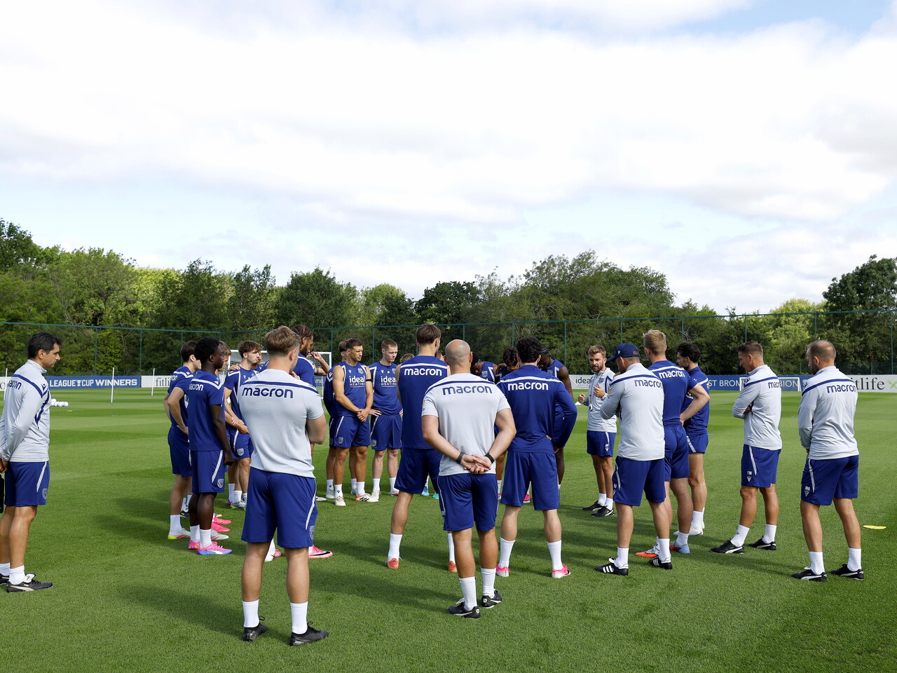 James Morrison speaking to his players and staff on the training pitch 