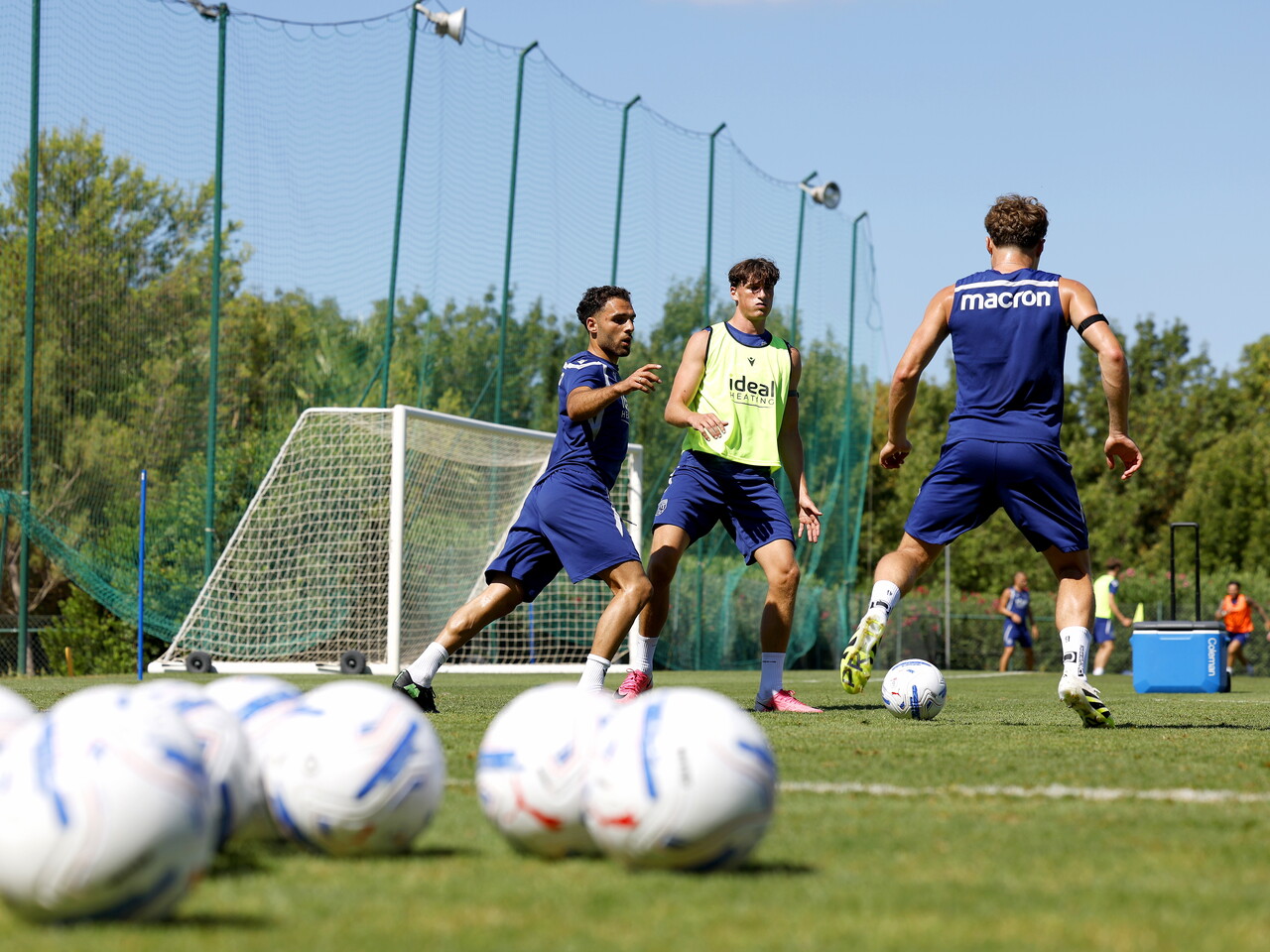 Tammer Bany, Callum Styles and Barney Stewart all close to the ball during a training session