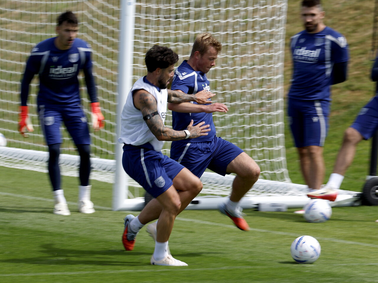 Aune Heggebø and Alex Mowatt fighting for the ball during a training session 