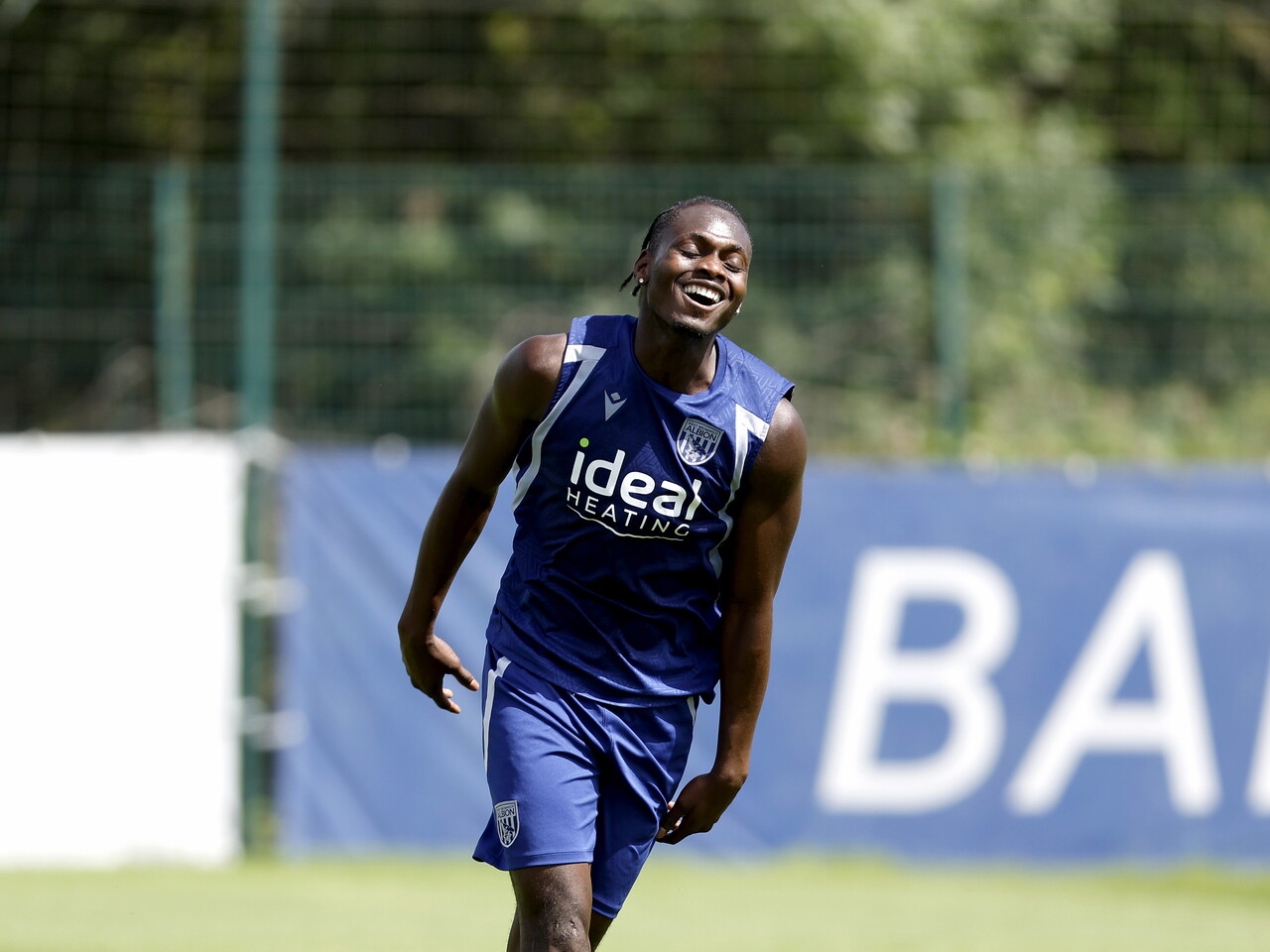 Ousmane Diakité smiling during a training session